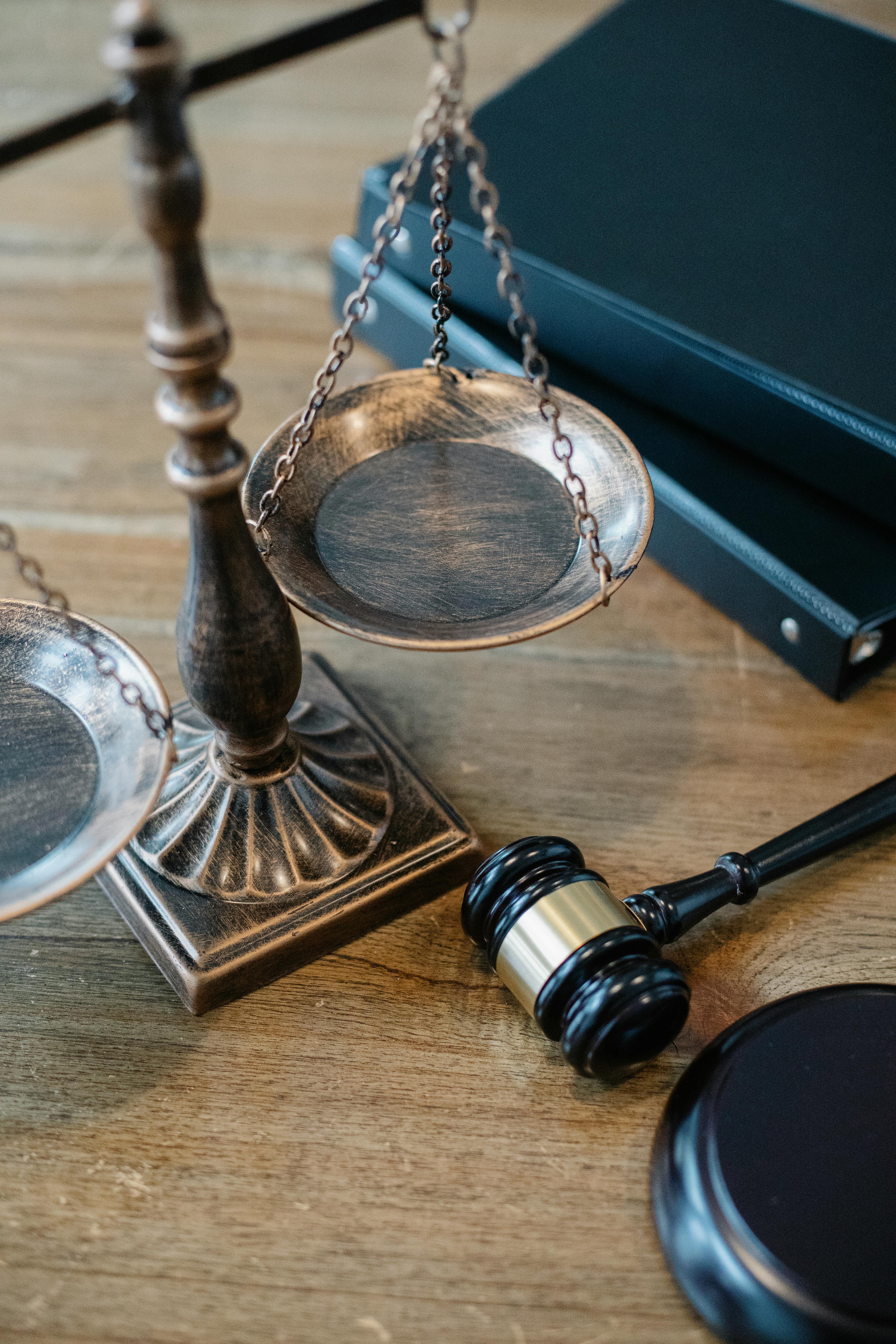 Justice Scales and Gavel on Wooden