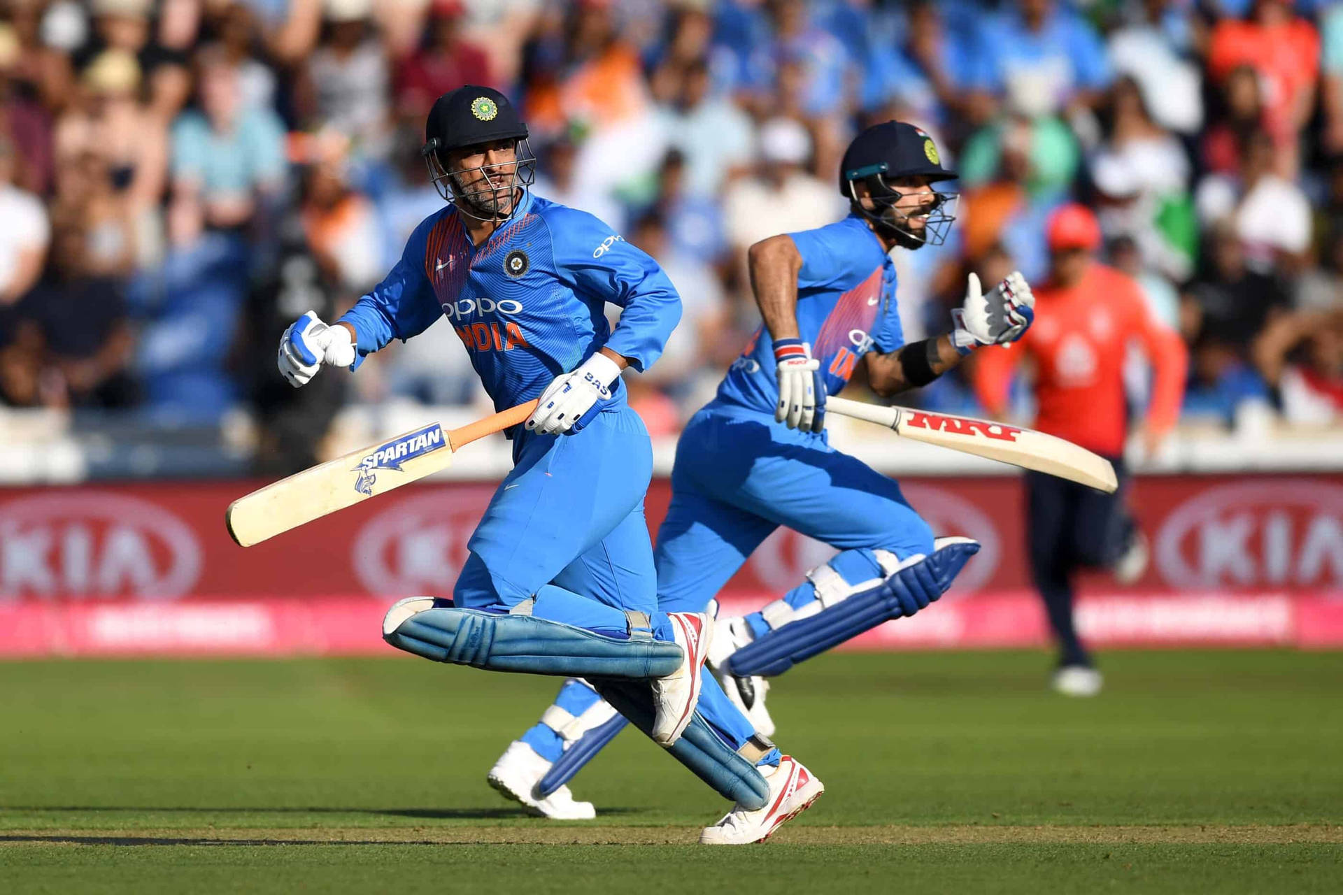 Cricket Duo Running Between Wickets