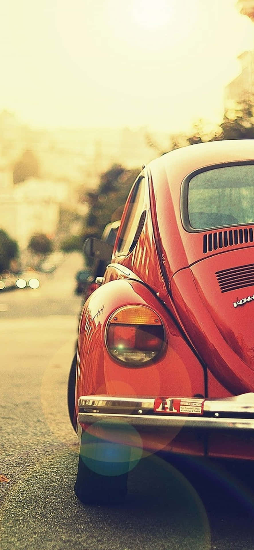 Download A Red Volkswagen Beetle Parked