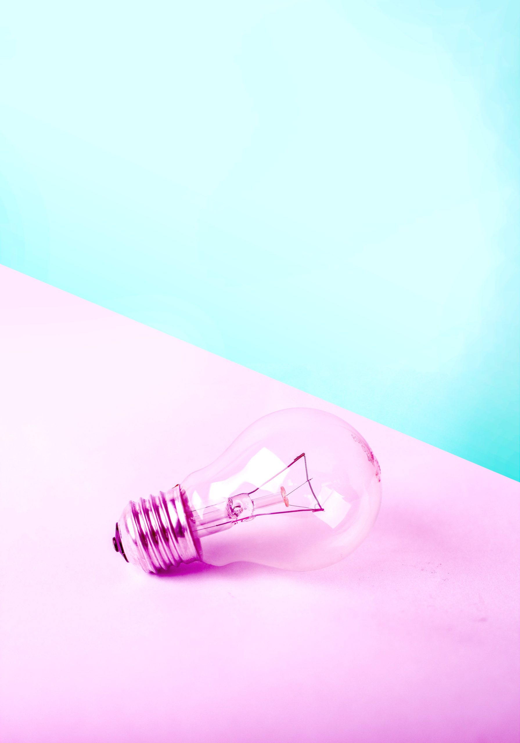light bulb on pink and blue background