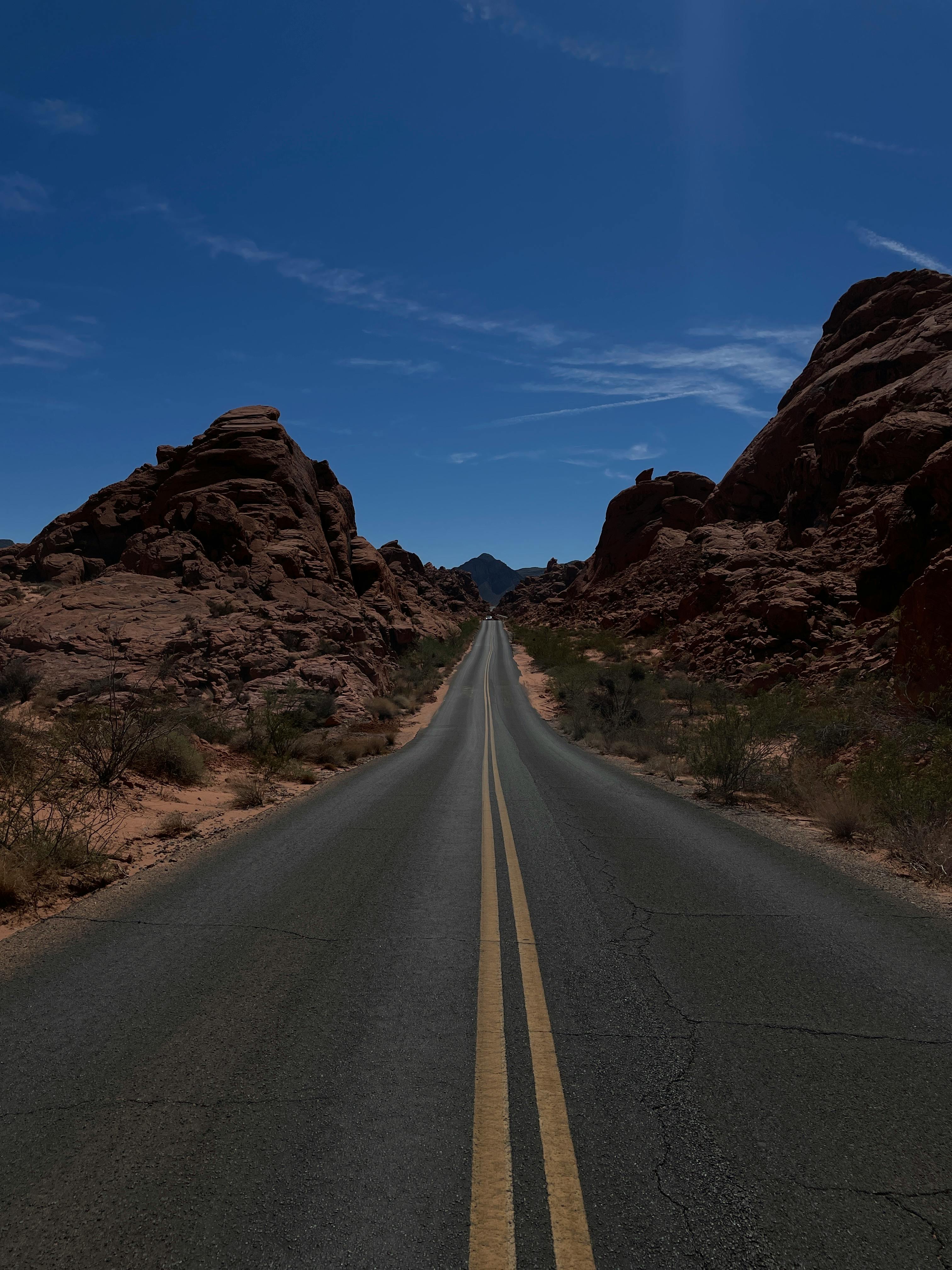 Road among Rocks under Clear Sky · Free