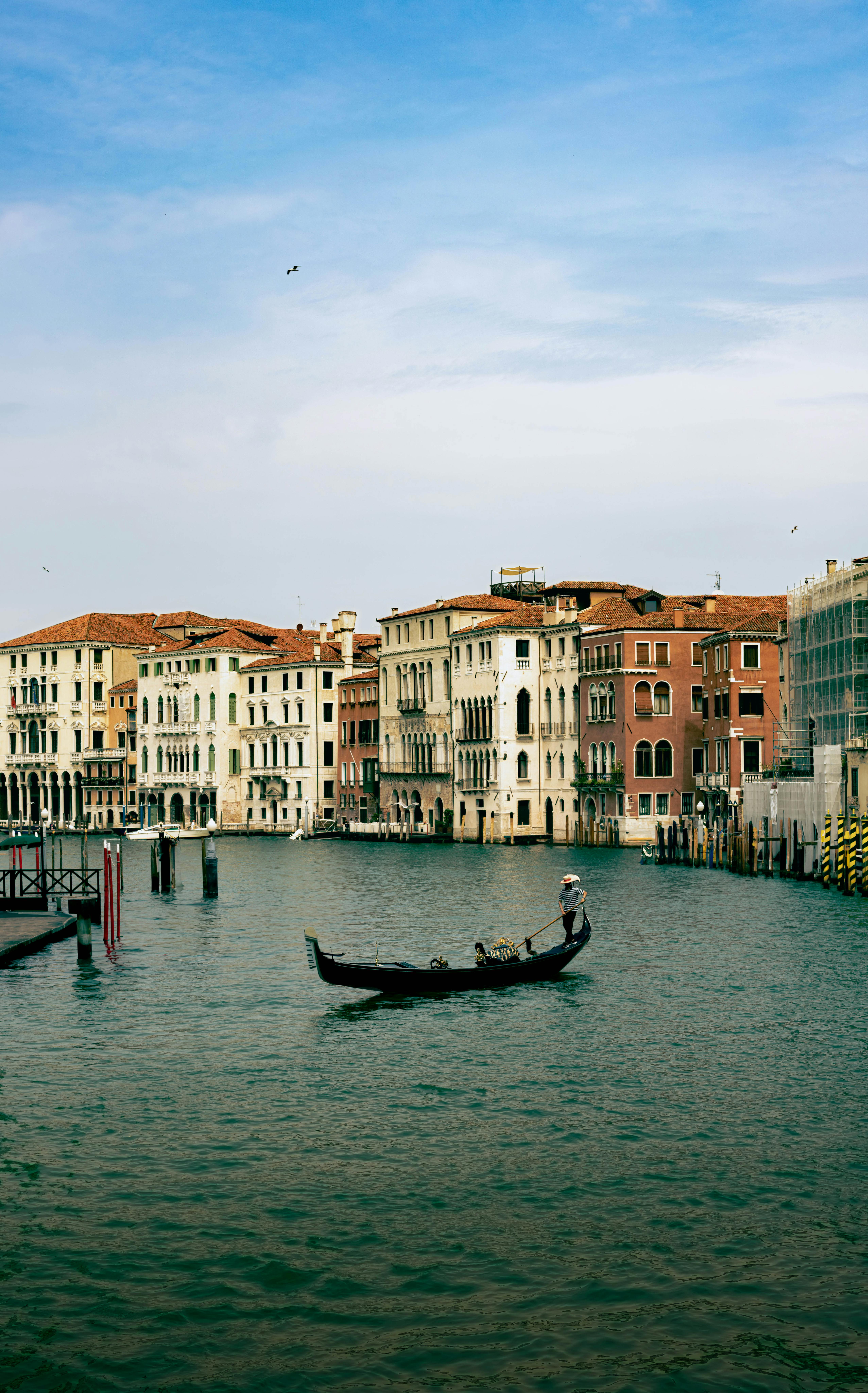 Person on Gondola on Canal in Venice