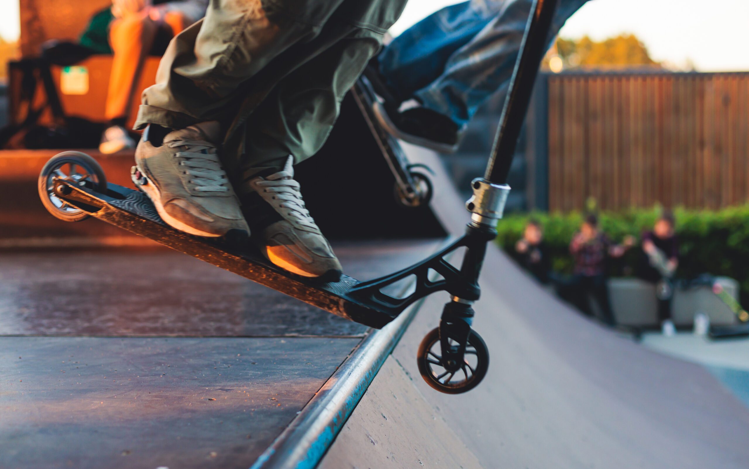 Skate park with kids on a kick scooter