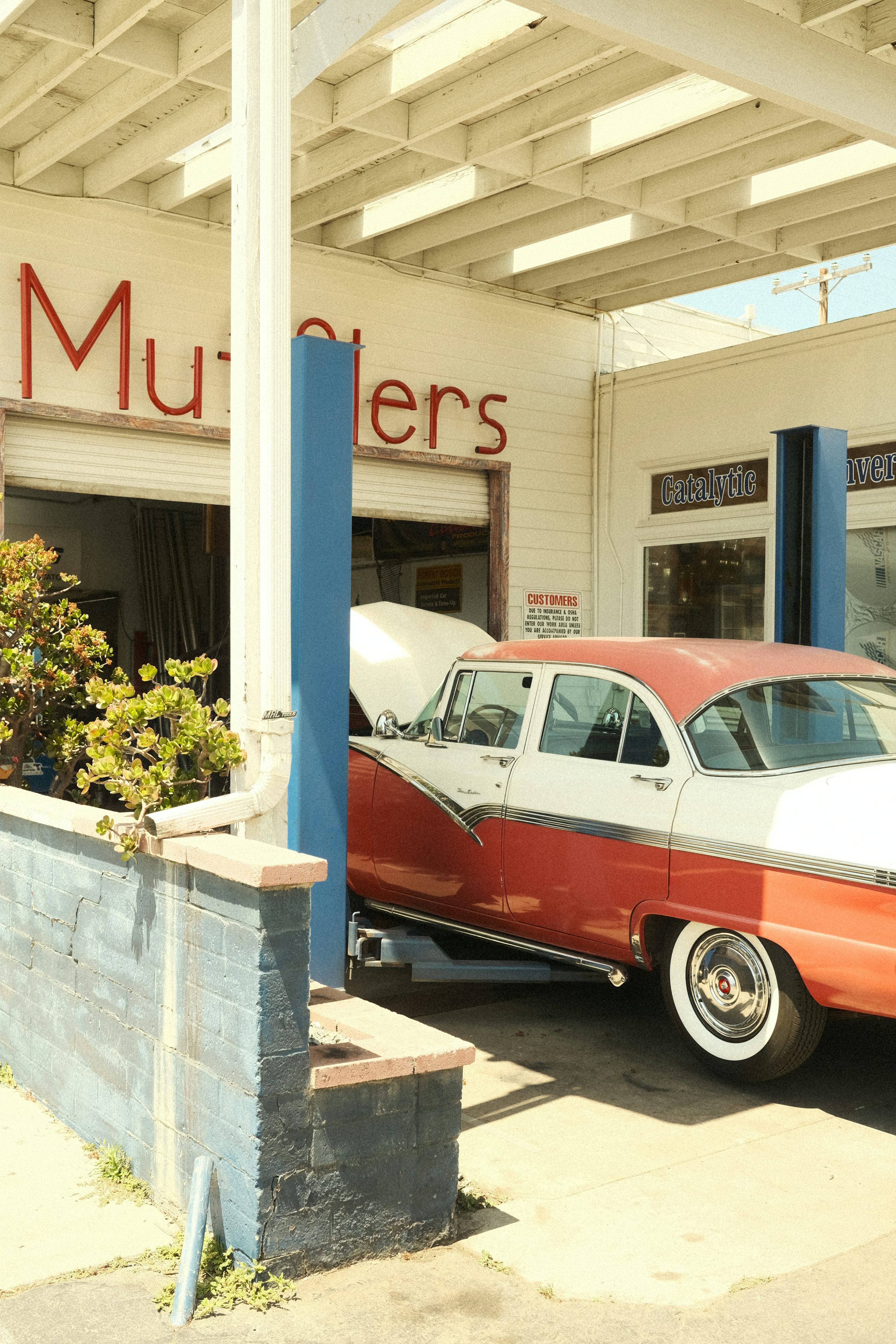 getting serviced at a vintage auto shop