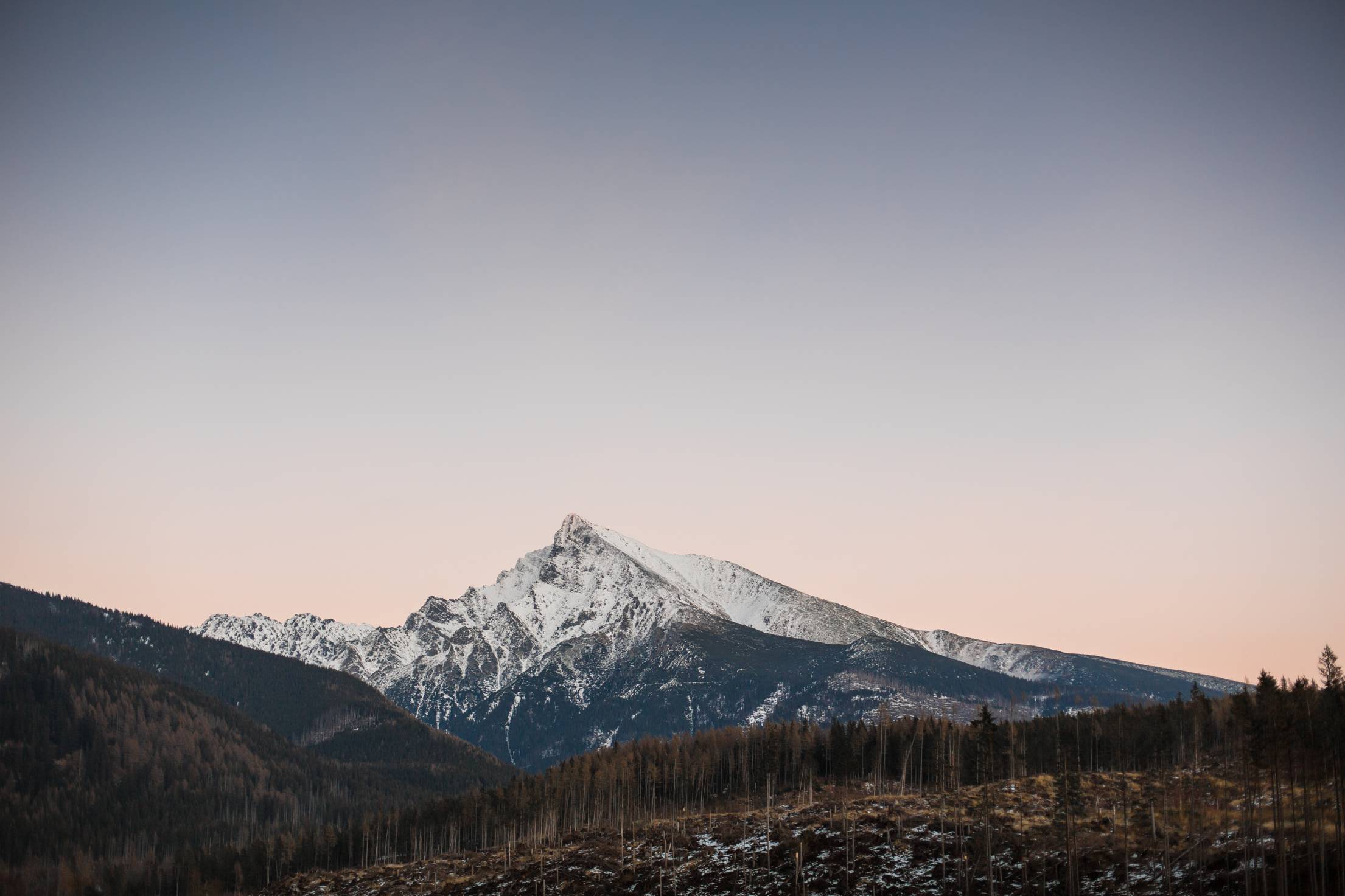 Sunset Over Snowy Top of The Mountain