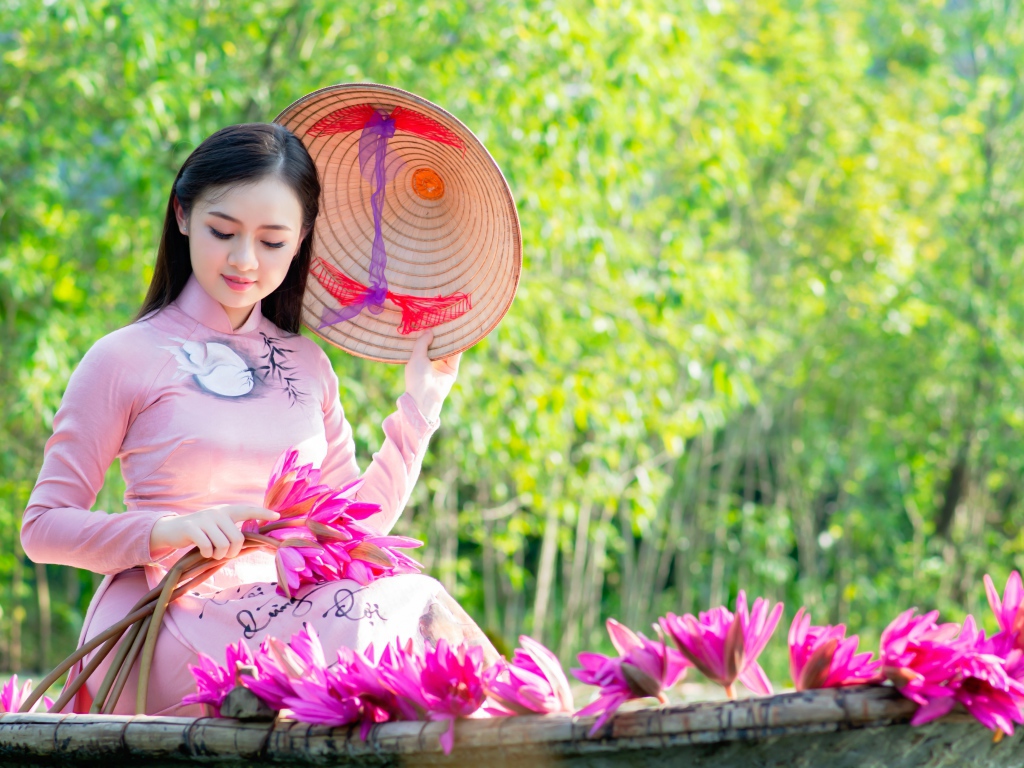 Beautiful asian girl in a boat with lotus flowers Desktop wallpaper 1024x768