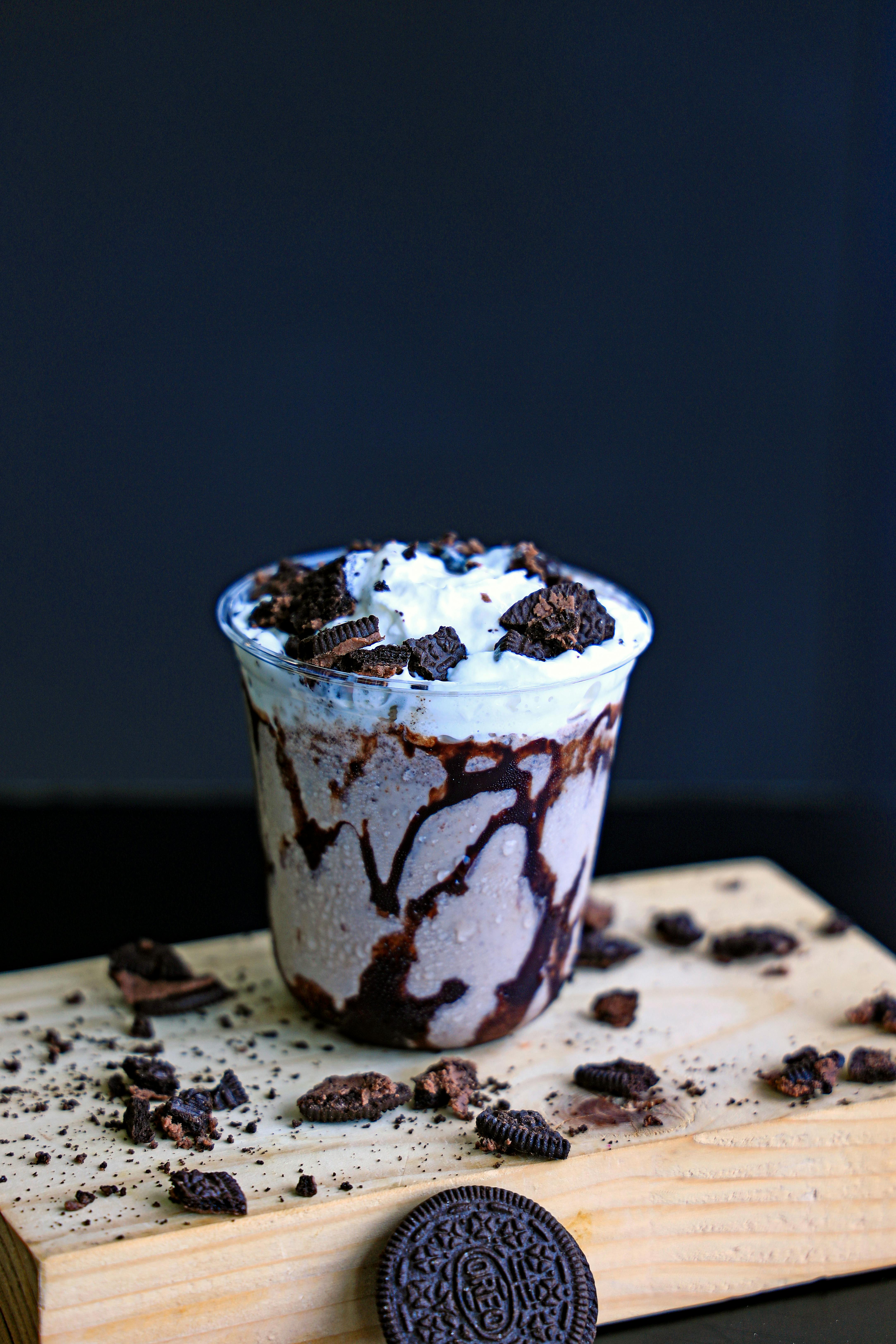 A chocolate milkshake with oreo cookies