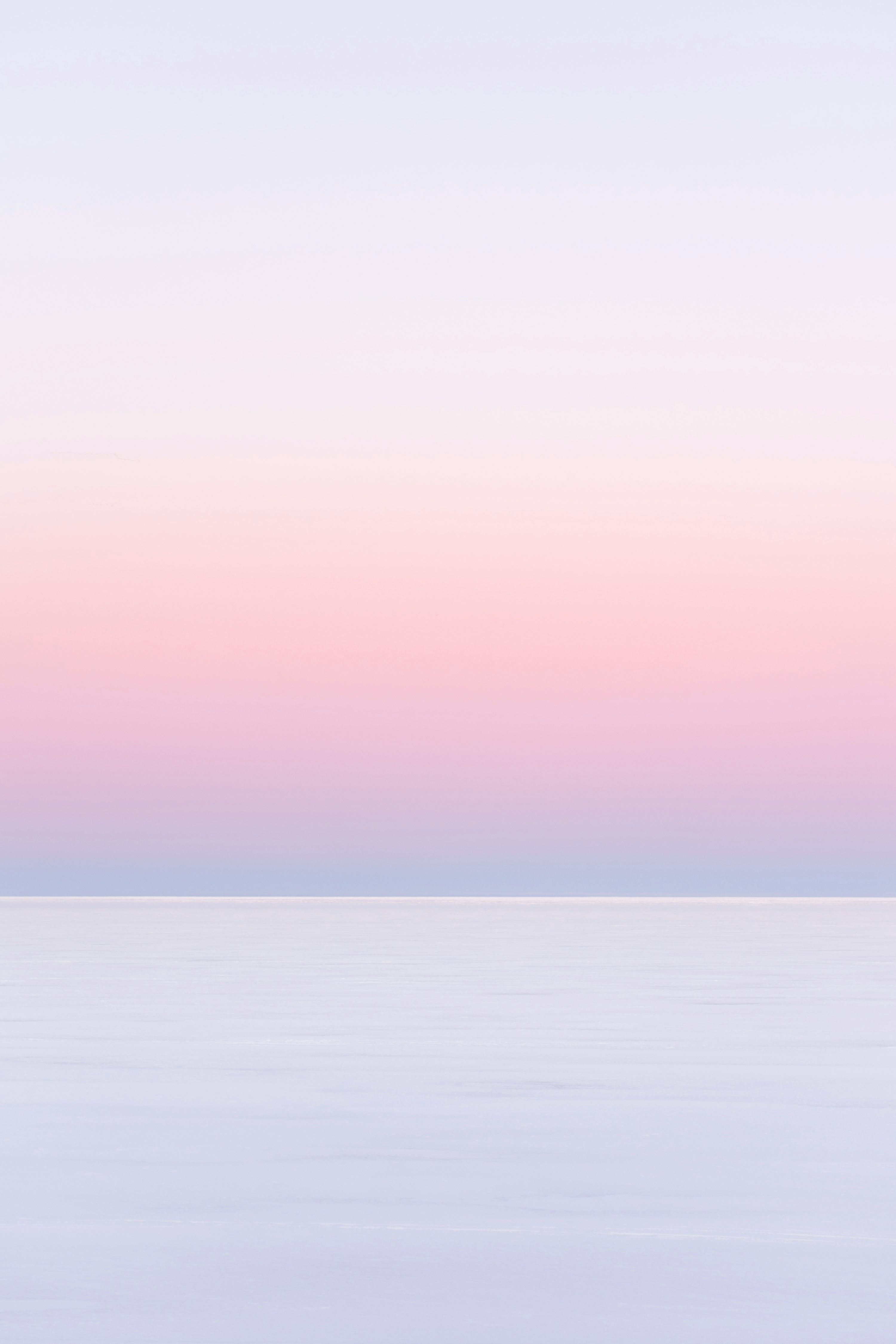 White and pink sky over the sea photo