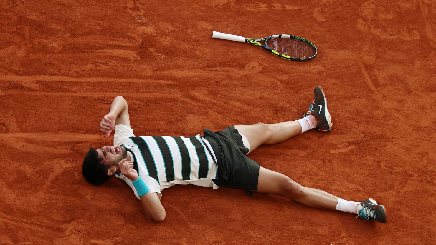 Carlos Alcaraz wins Roland Garros, completing historic comeback from two sets down to defeat Jannik Sinner in men's final