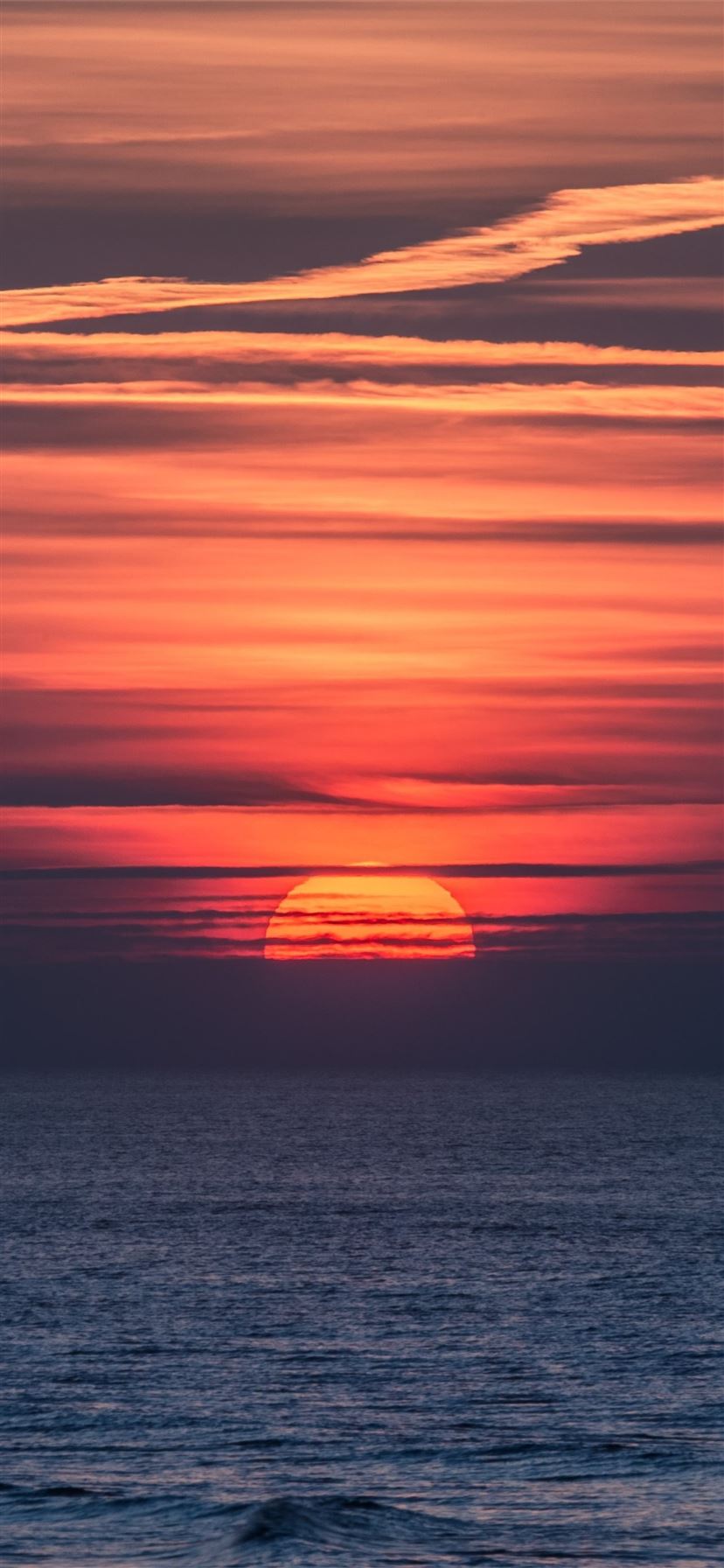 body of water doing sunset 4k iPhone 11 Wallpaper Free Download