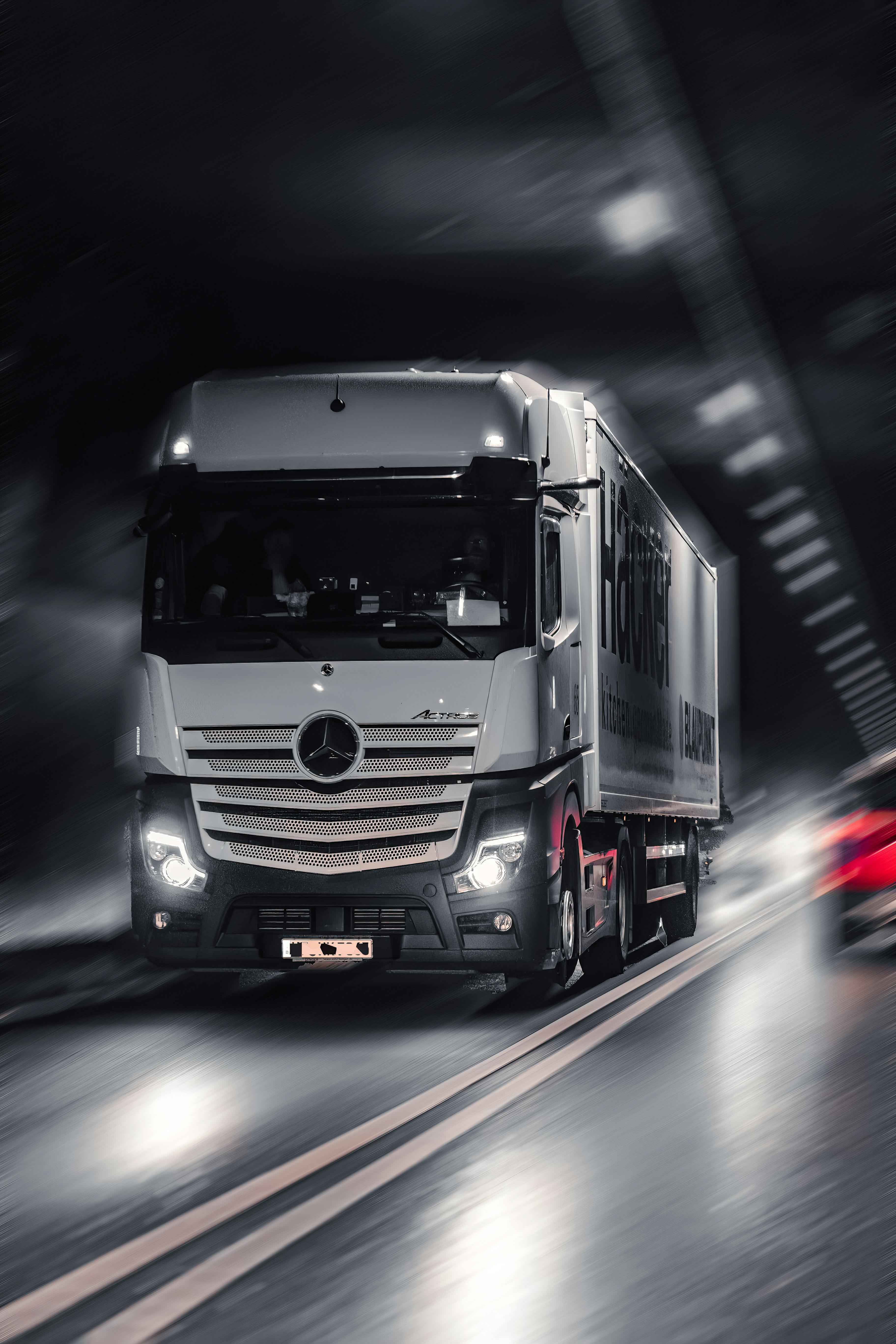 View Of A Mercedes Benz Actros Driving On A Street · Free