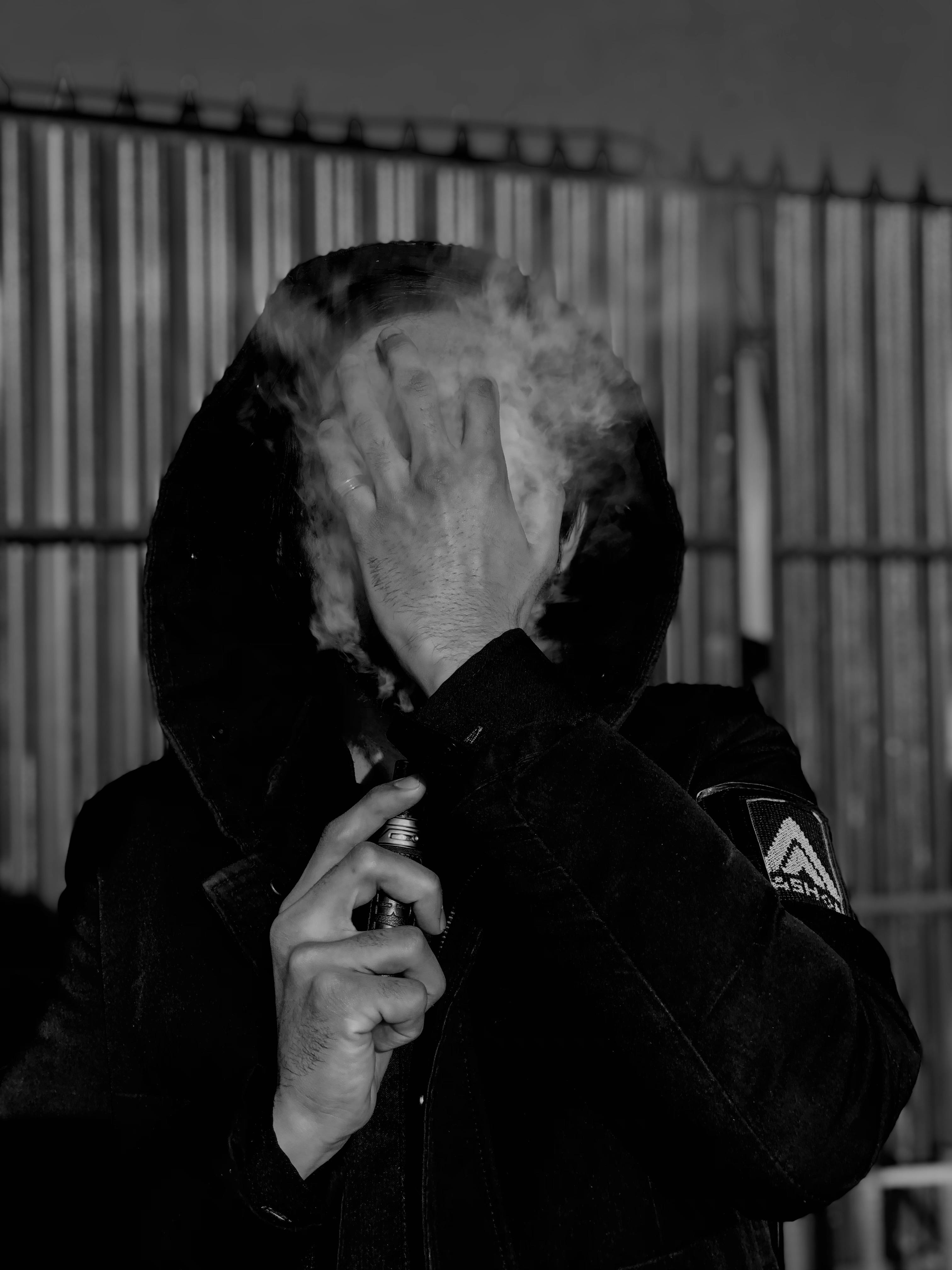 Man in Hoodie Smoking · Free