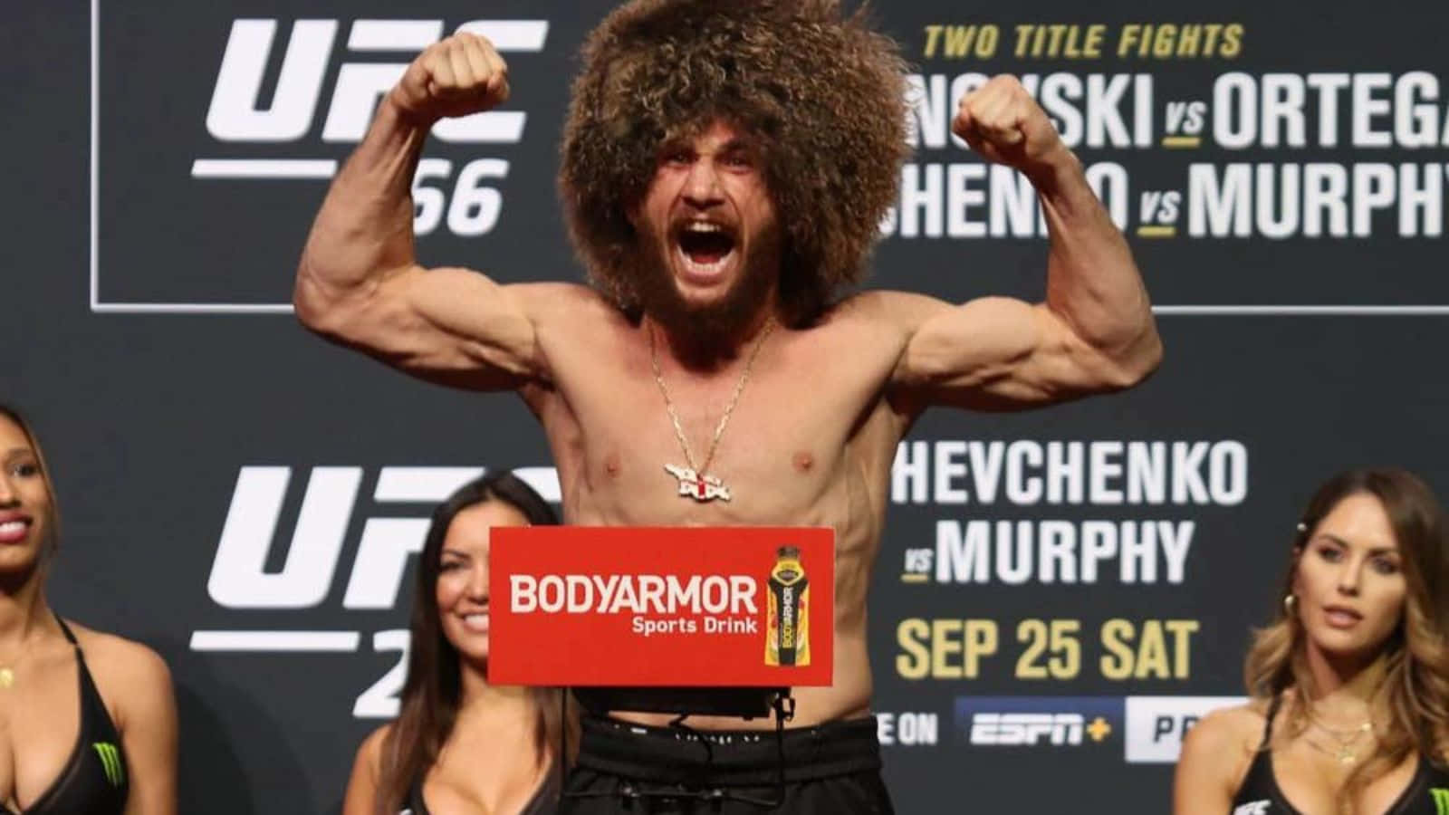 Download Merab Dvalishvili Showing His Muscles Wallpaper