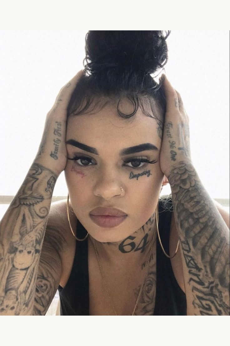 Download A Woman With Tattoos On Her Head