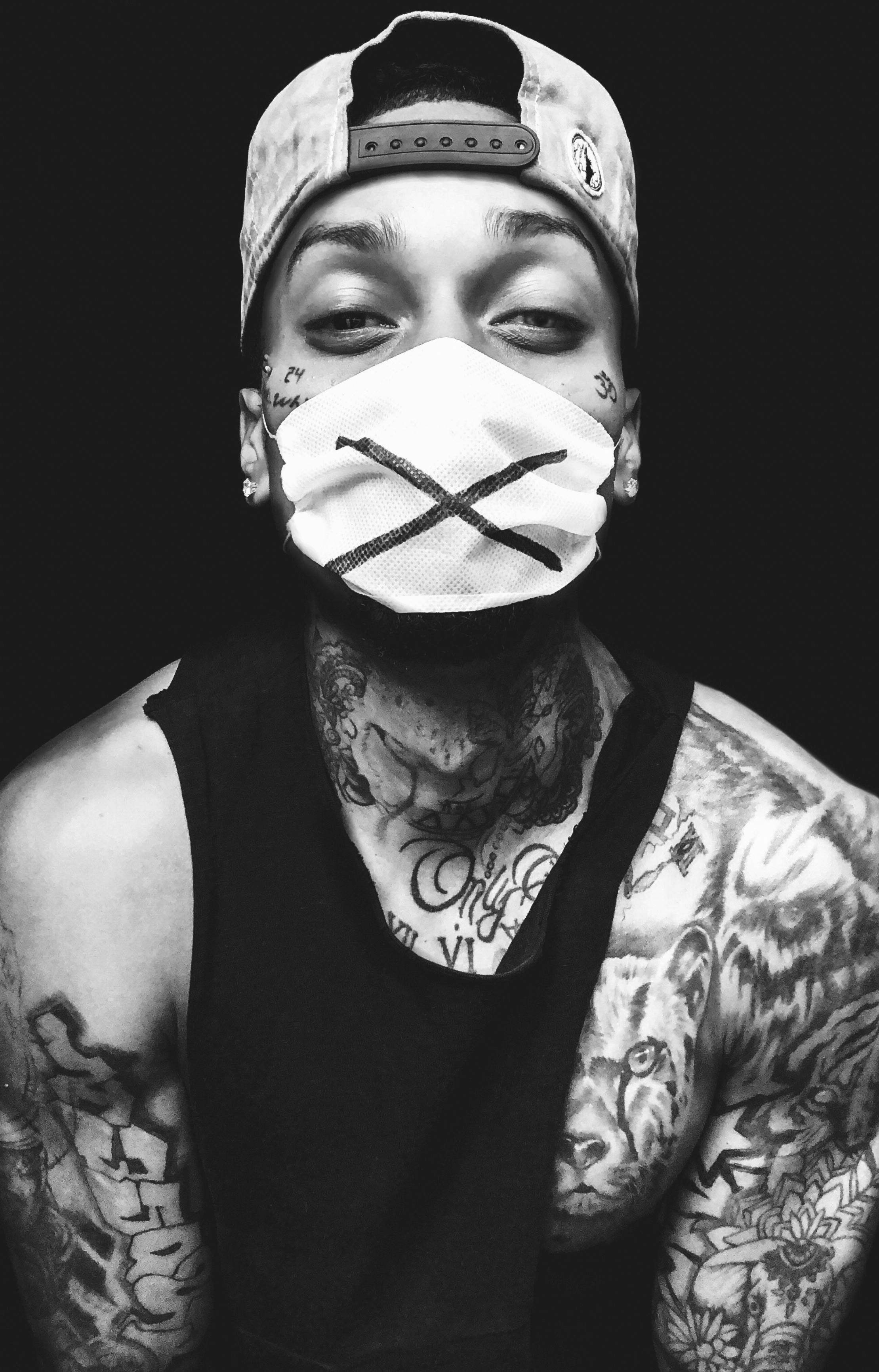Tattooed Rapper with Face Mask · Free