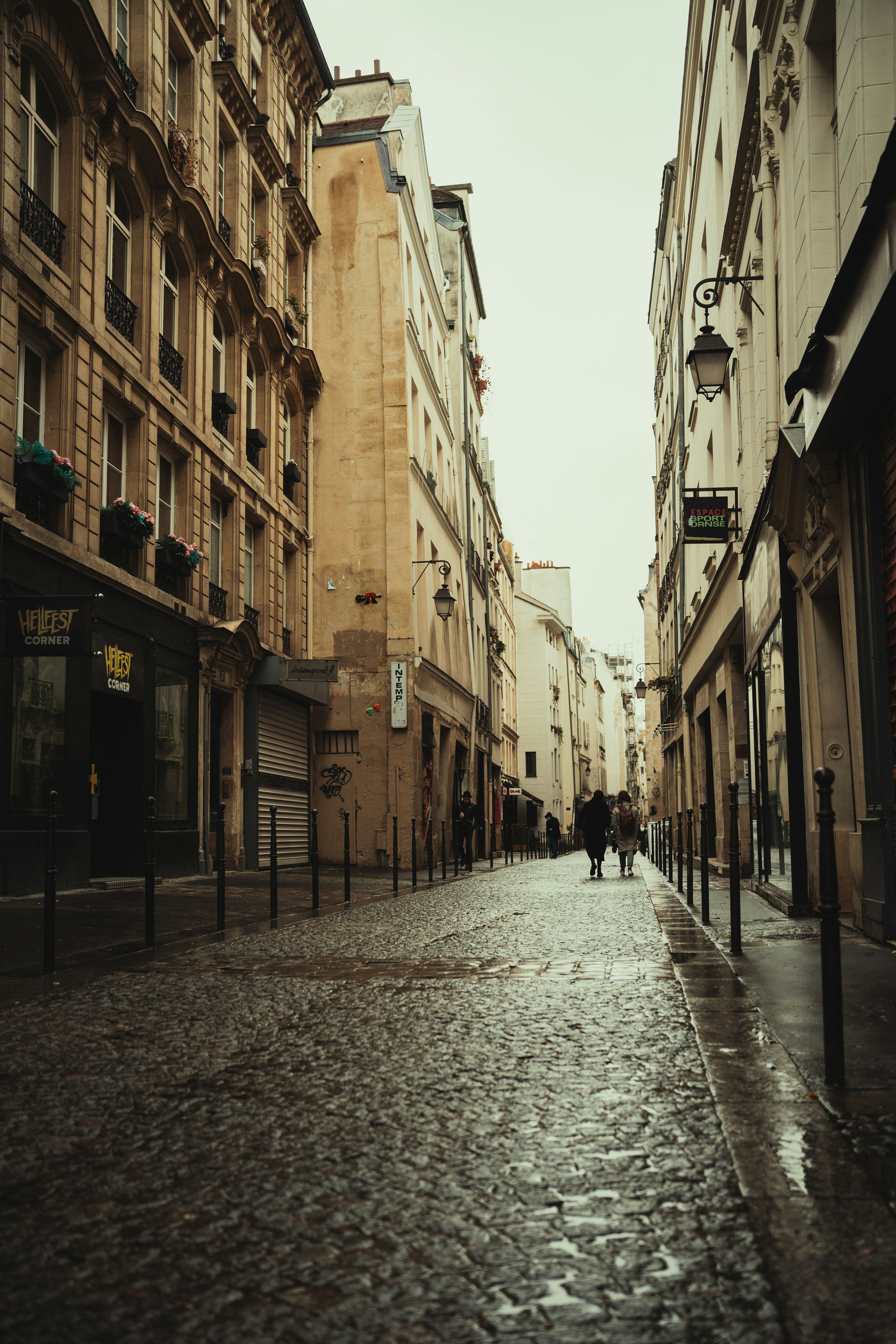A city street lined with tall buildings next to each other photo