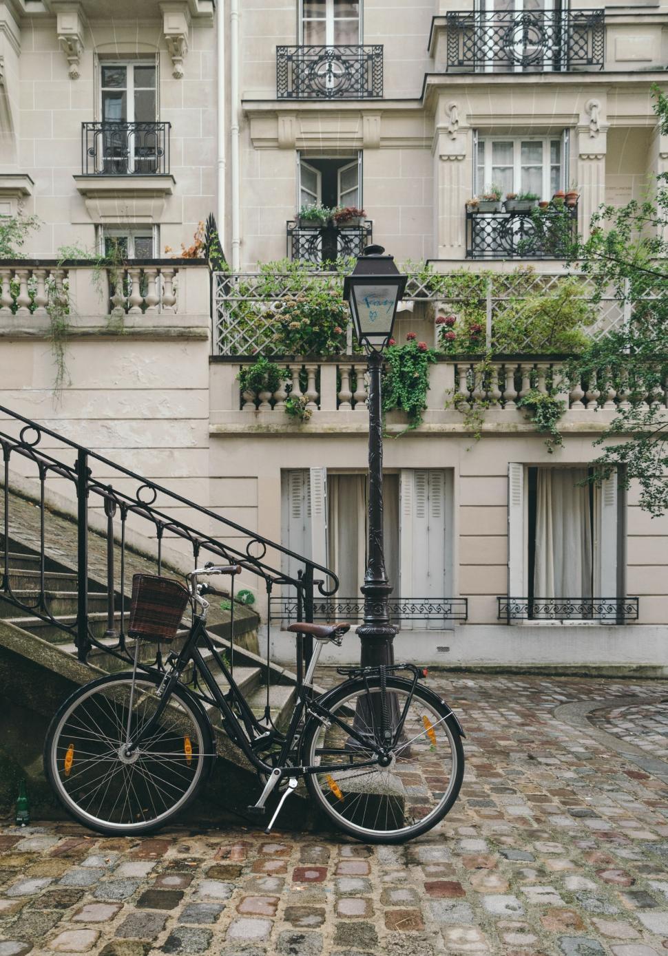 Free of Corner of cobblestone street with vintage bicycle, Europe. Download Free Image and Free Illustrations