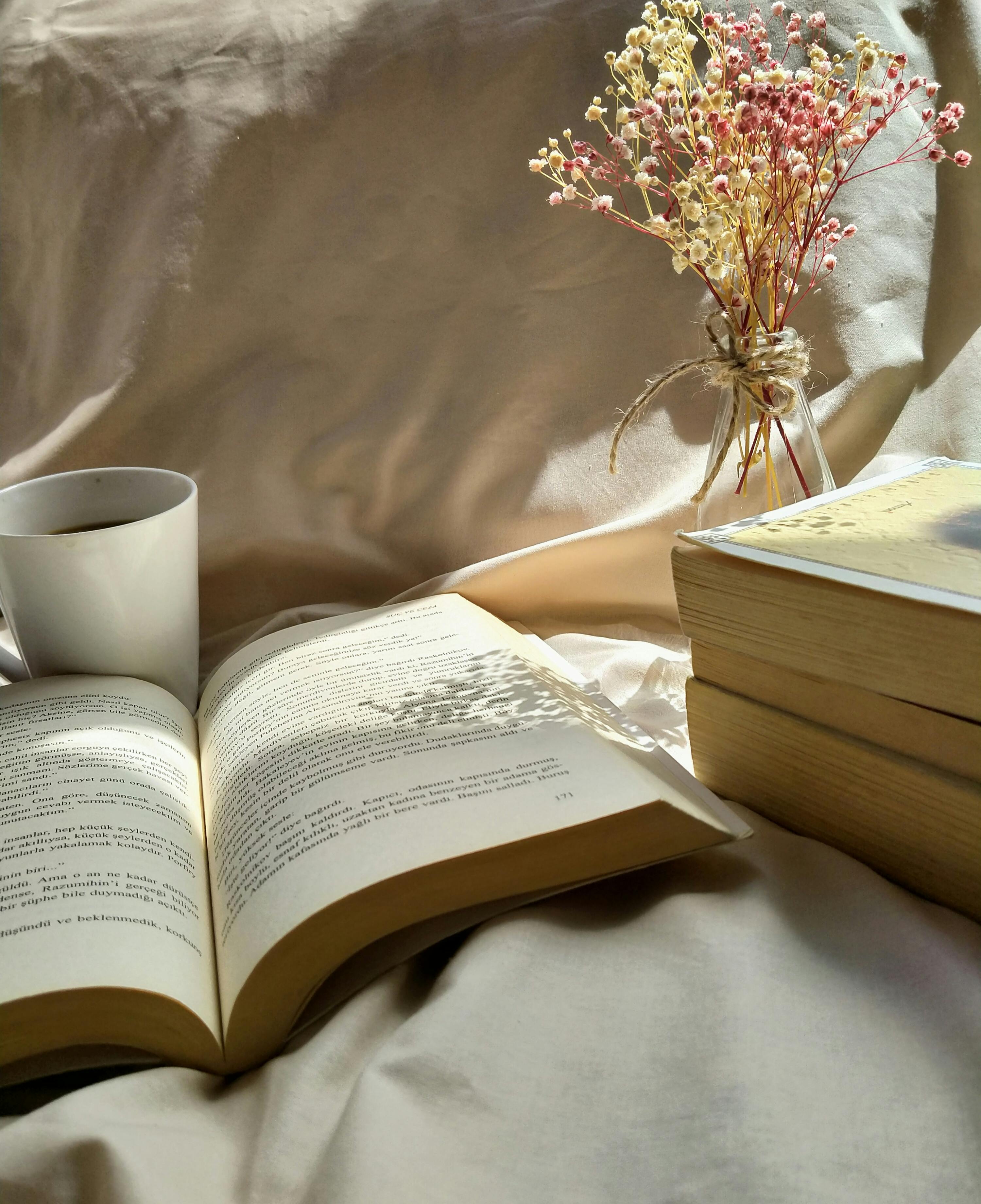 A Close Up Shot Of Books And A Cup Of Coffee · Free