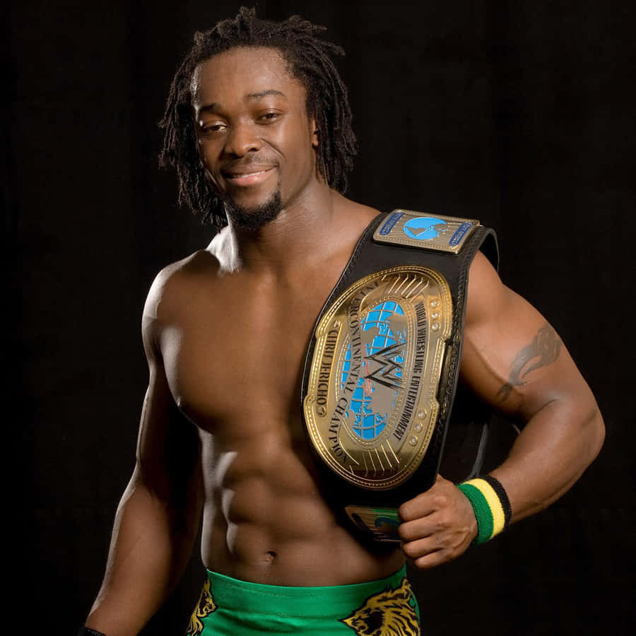 Download free Champion Kofi Kingston Proudly Displays His Wwe Belt. Wallpaper