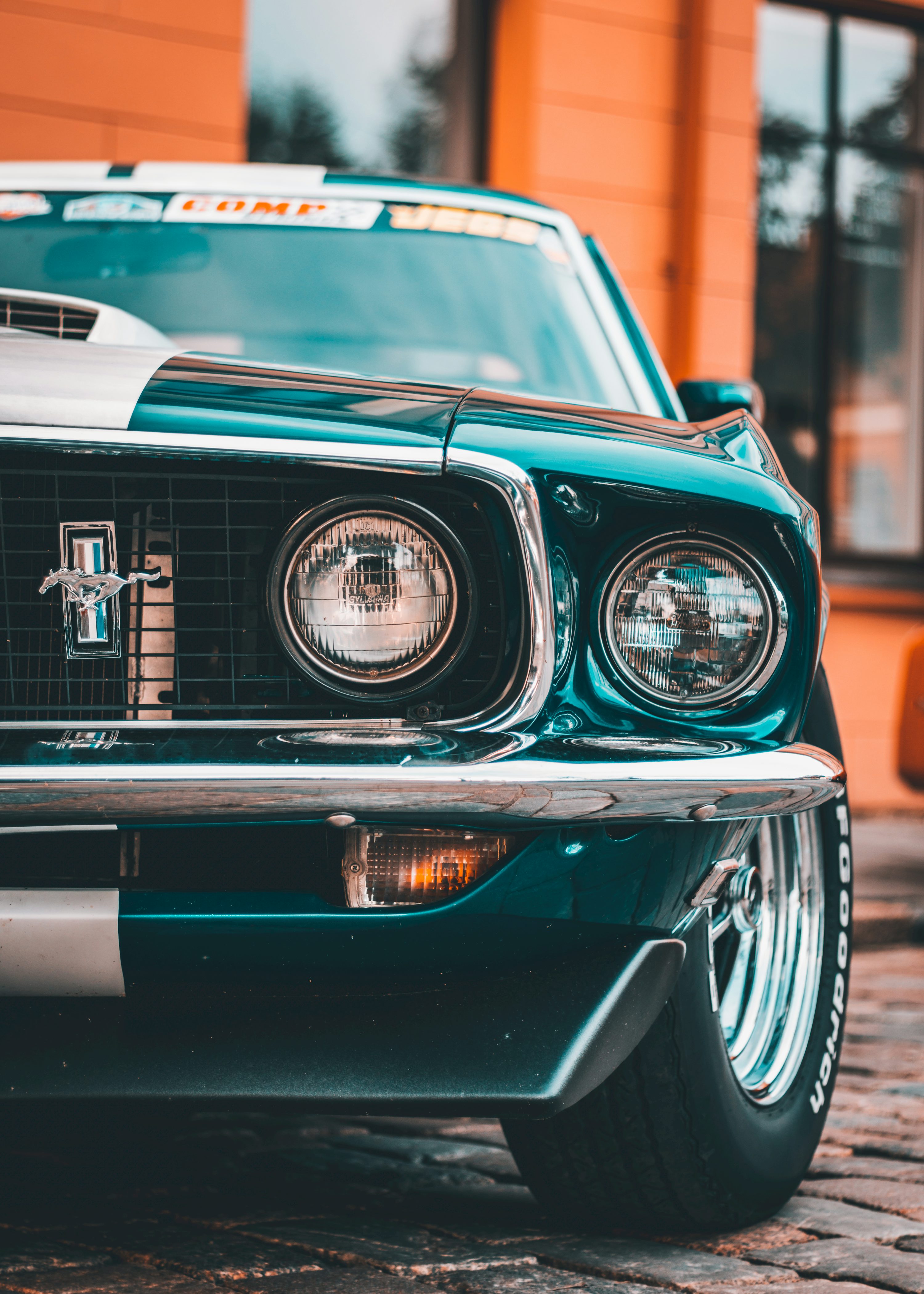 The front end of a green mustang car photo