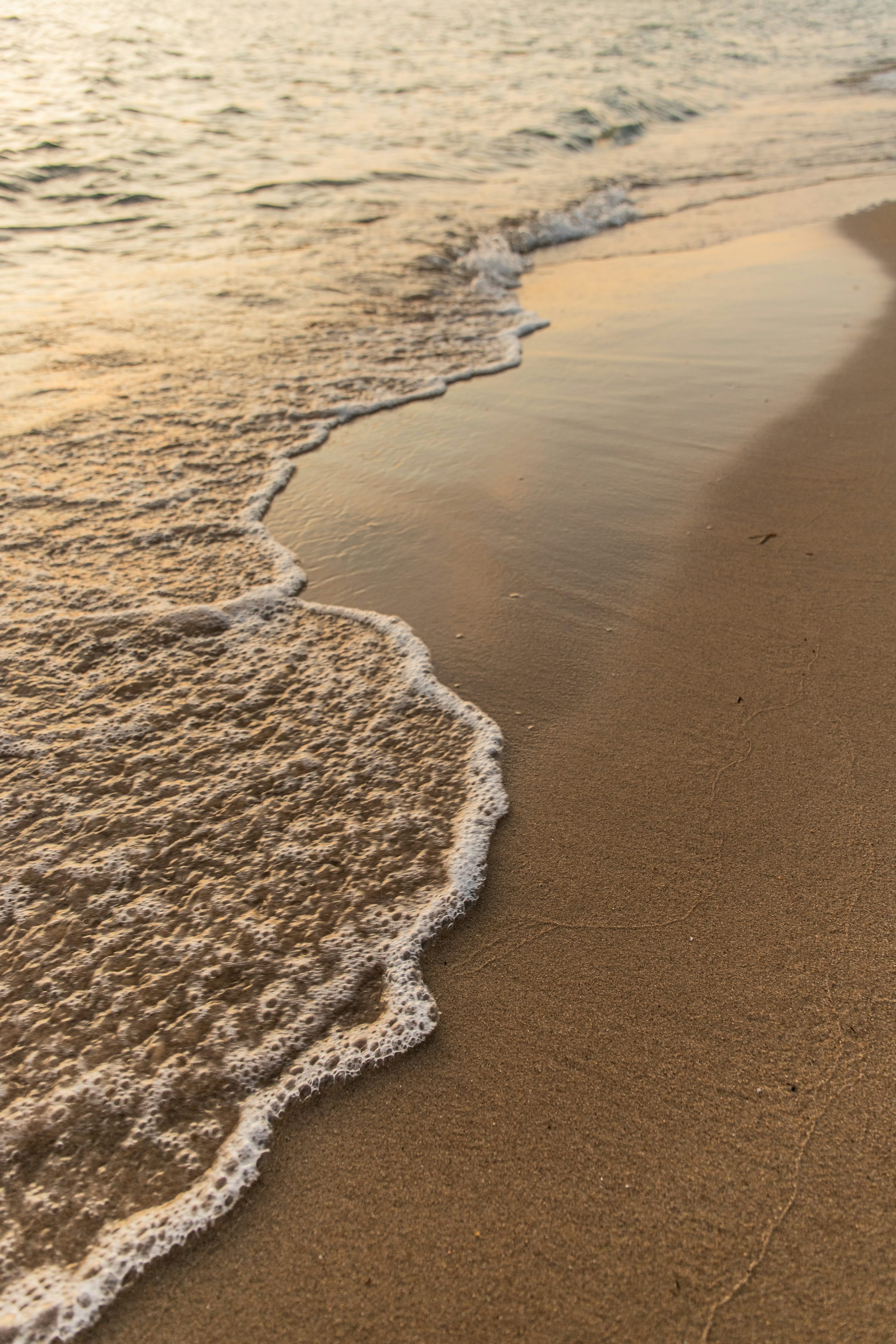 Brown sand on beach during daytime photo