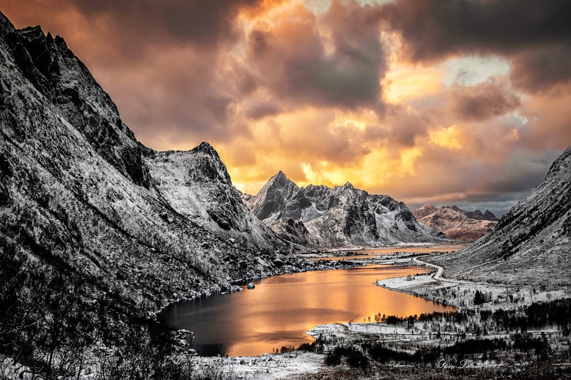 Landscape Mountain Ranges Over A Dramatic Sky · Free