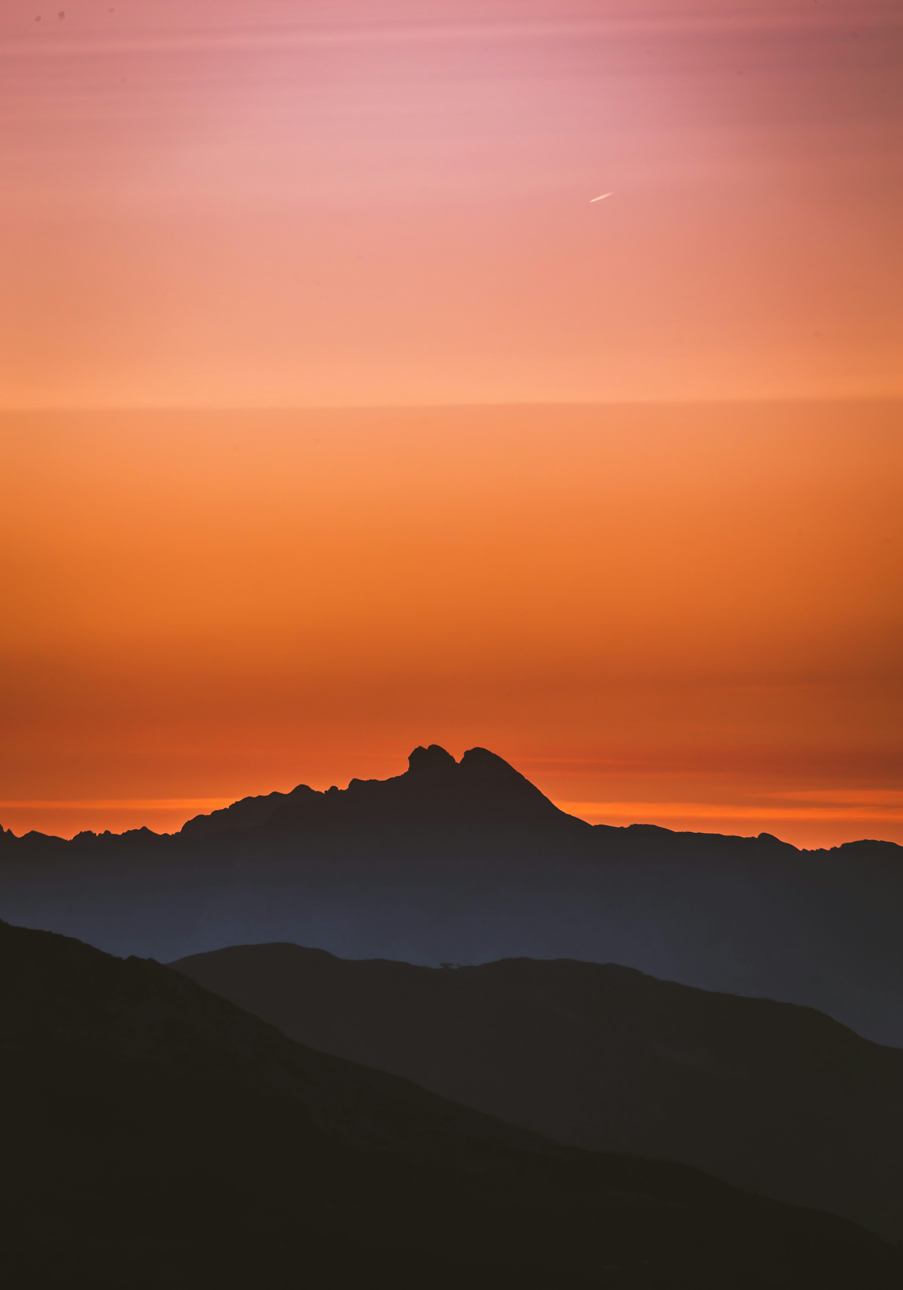 Silhouette of mountain during golden hour photo