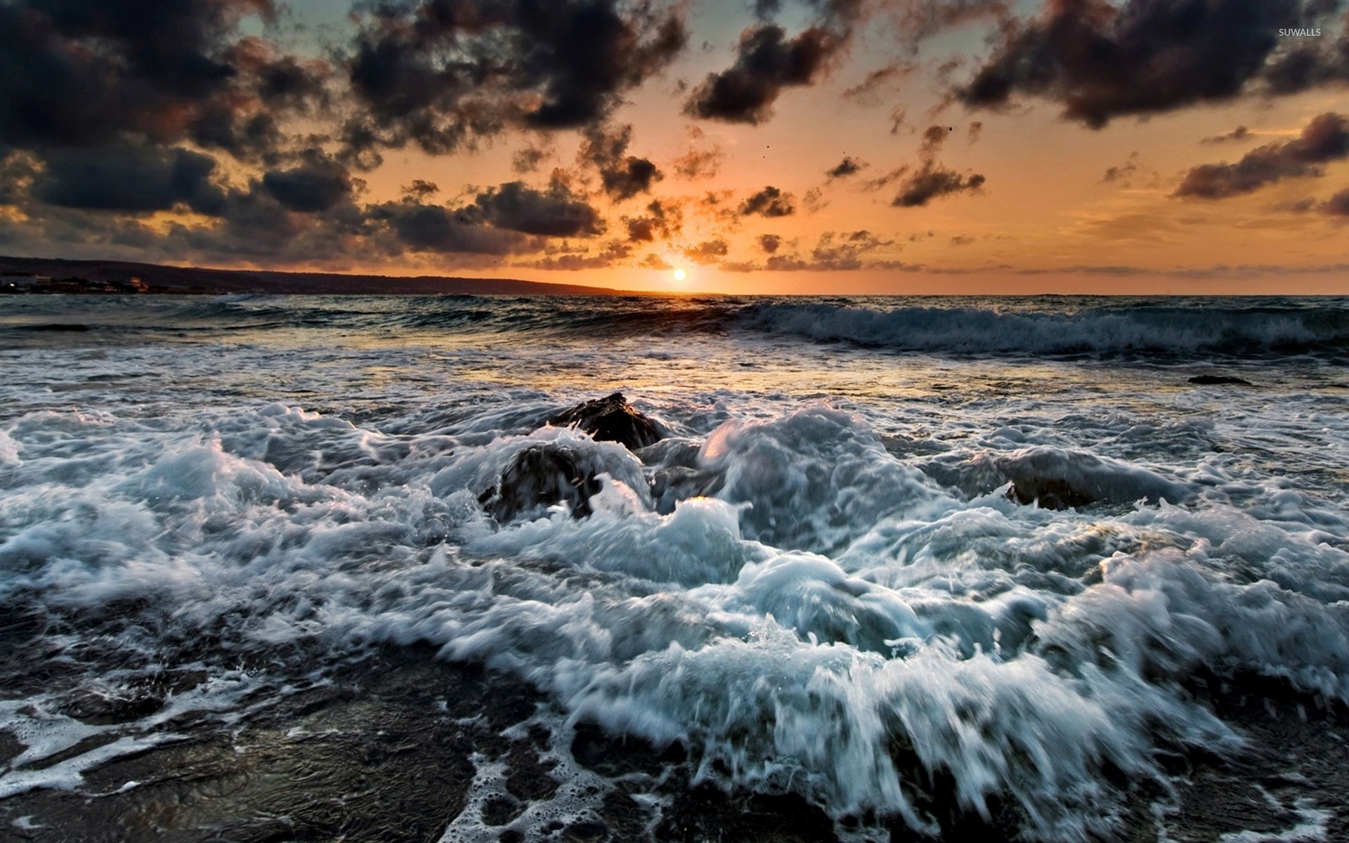 Waves reaching the rocky beach at sunset wallpaper wallpaper