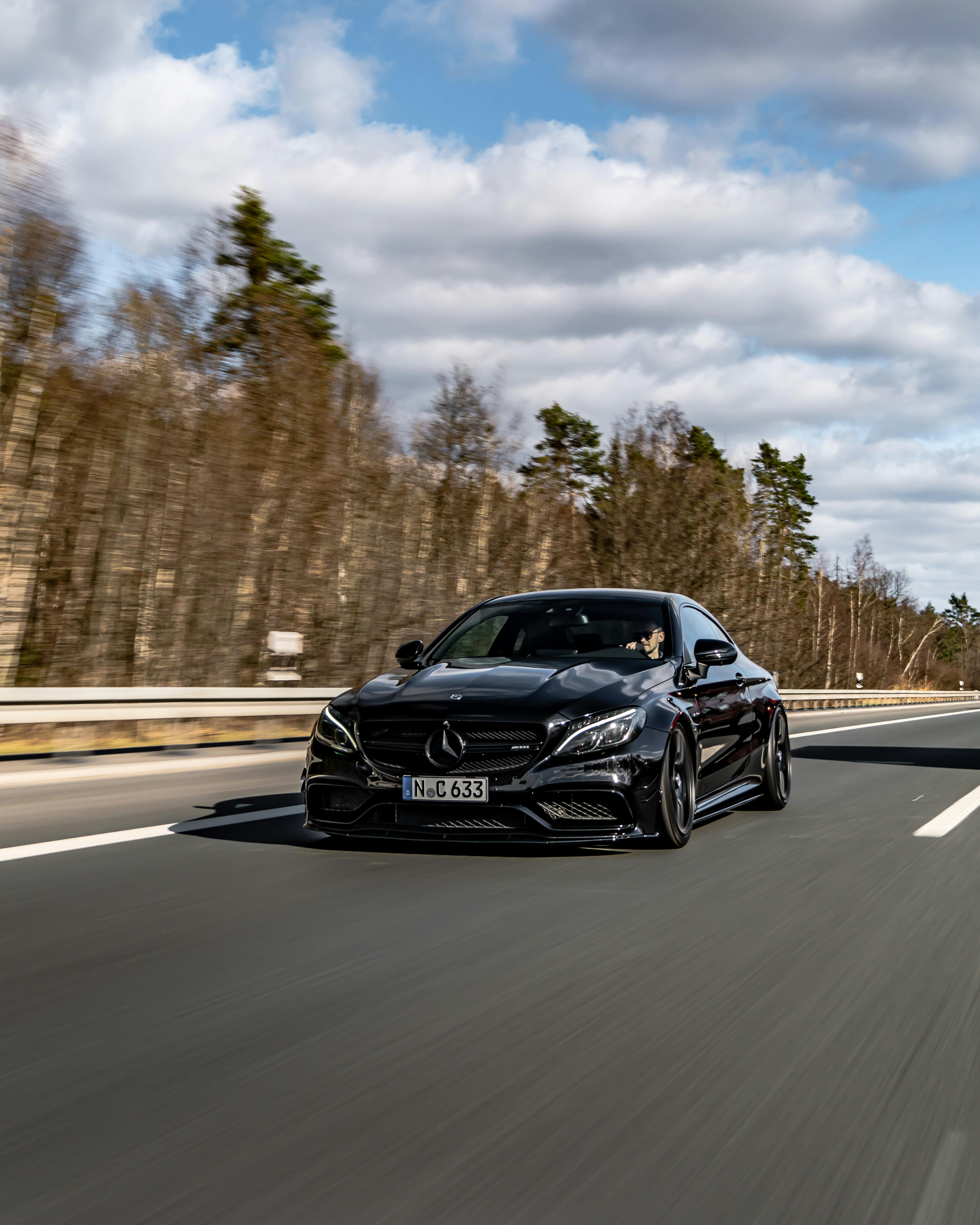 A Black Mercedes Benz C Class on a Road · Free