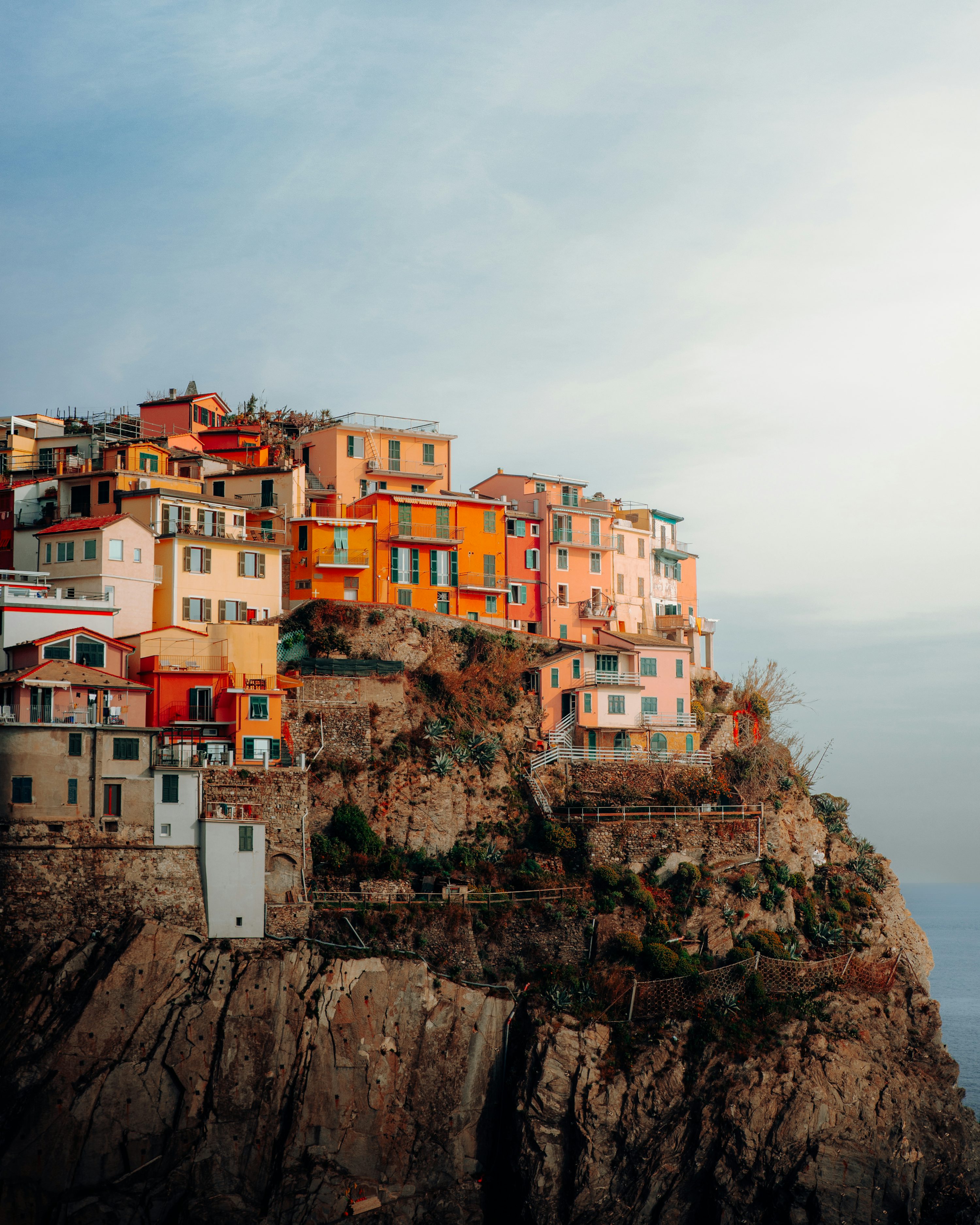 A small village on top of a cliff by the ocean photo