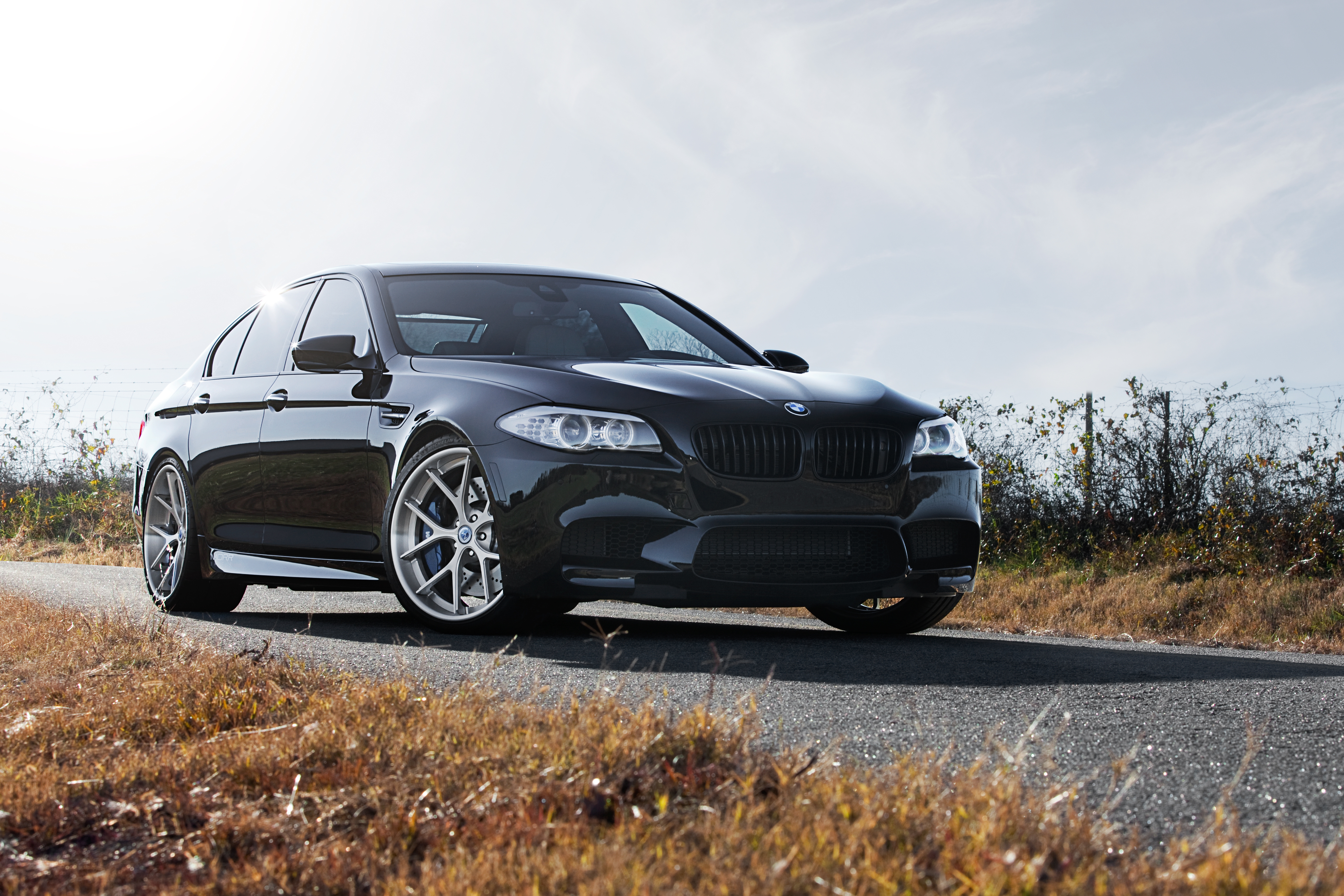 Black matte BMW M5 stands under the bridge · 1920x1200 free photo from godlike and wallpaper