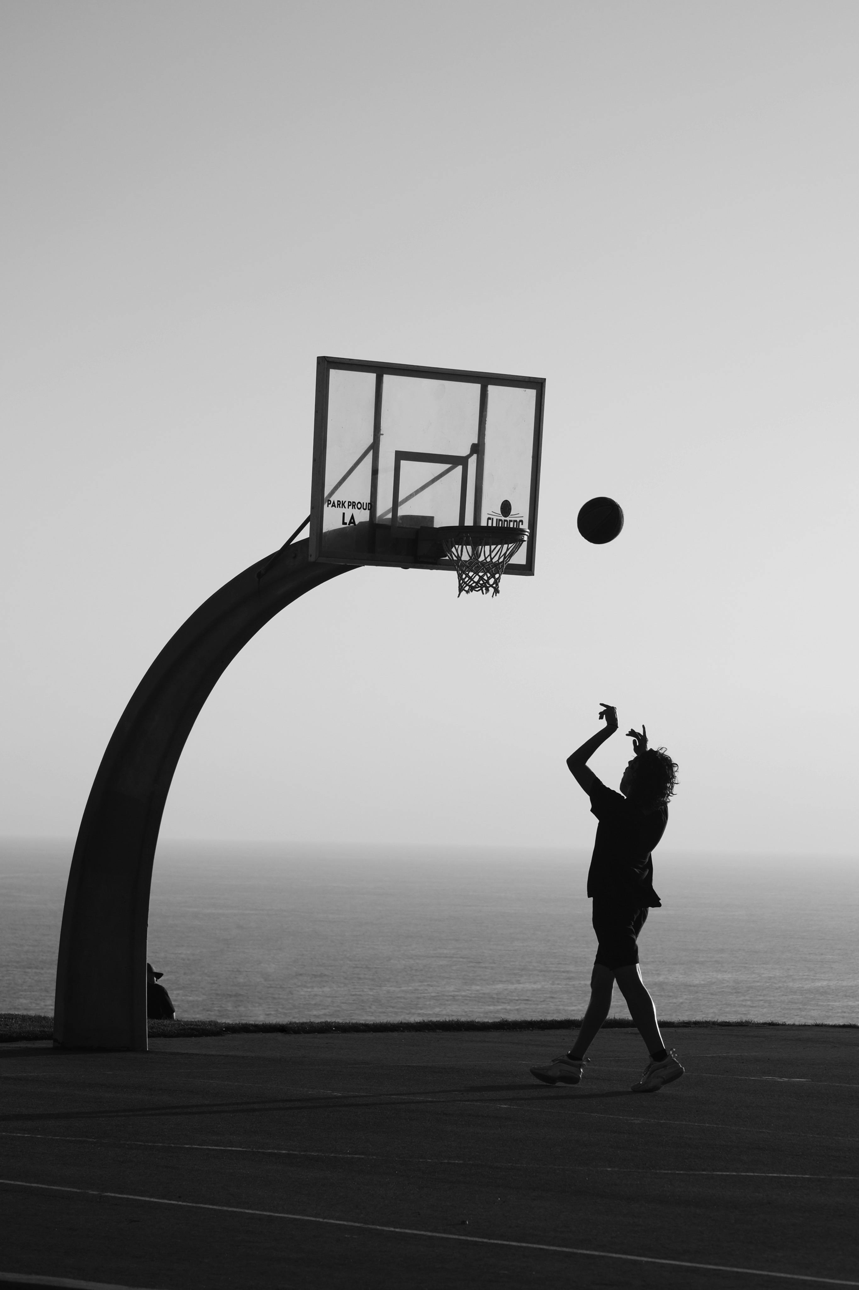 Silhouette of a Man Playing Basketball · Free