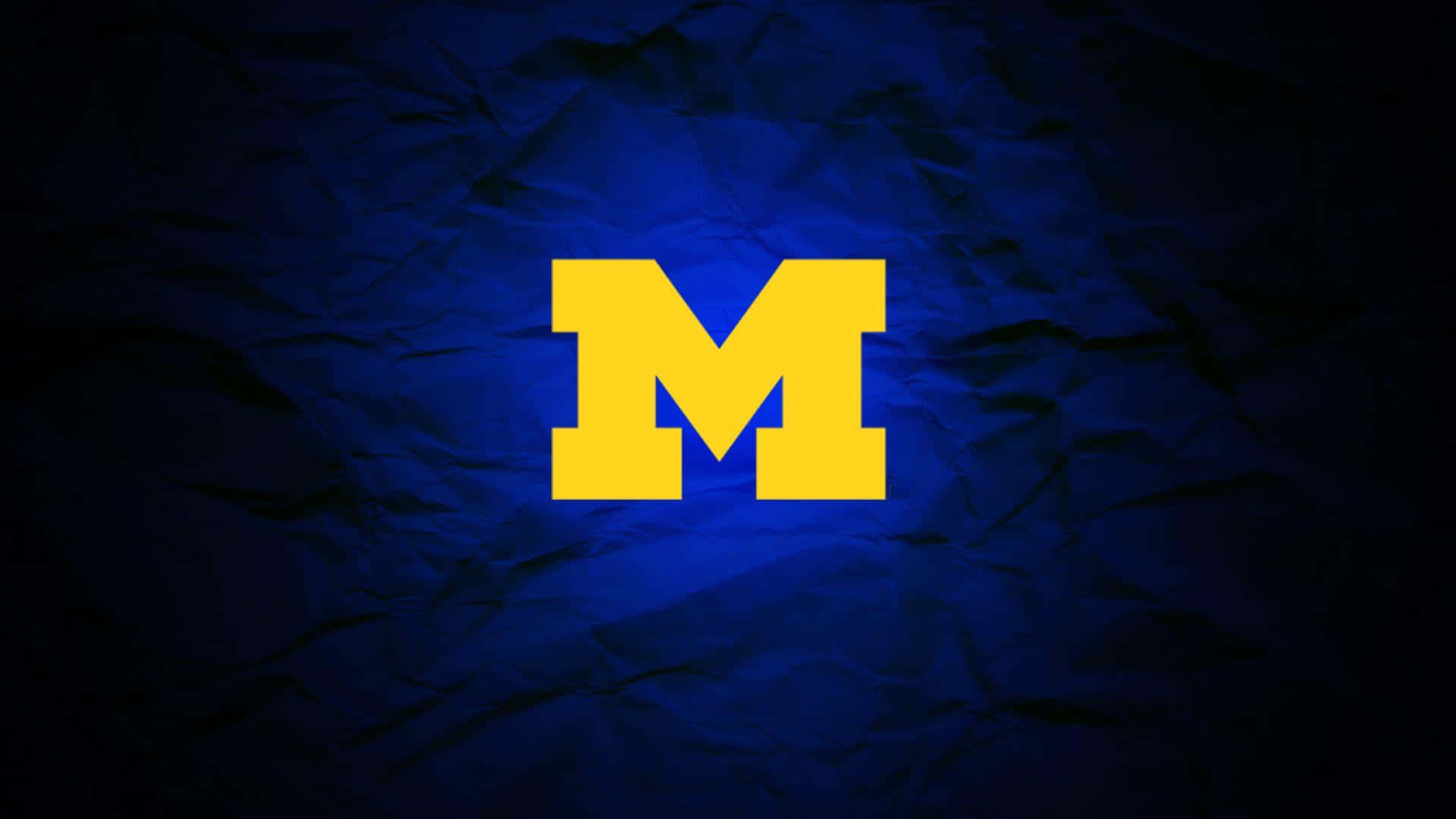 Download Glowing Michigan Football Team Logo Wallpaper