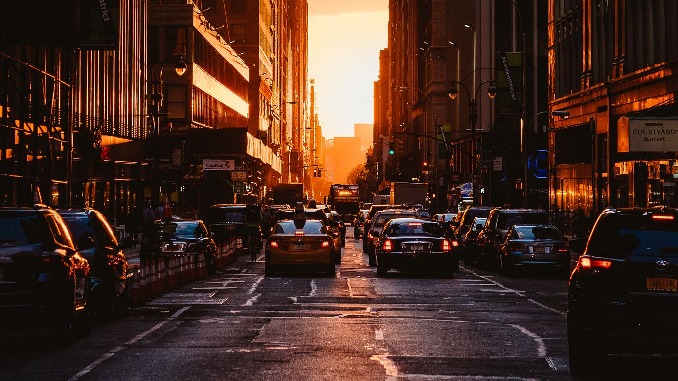 Download wallpaper 1366x768 city, sunset, new york, buildings, cars tablet, laptop HD background