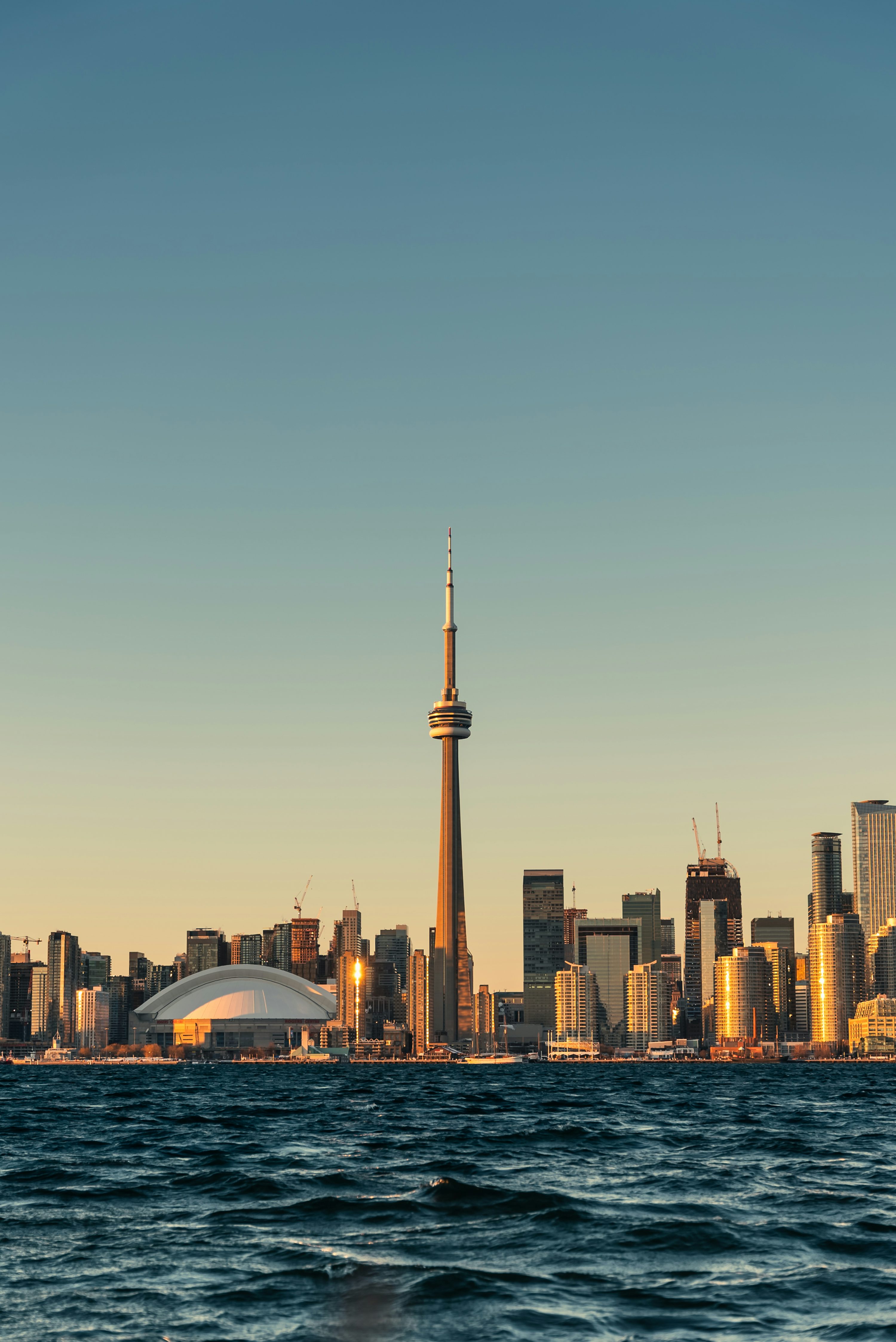 A large body of water with a city in the background photo