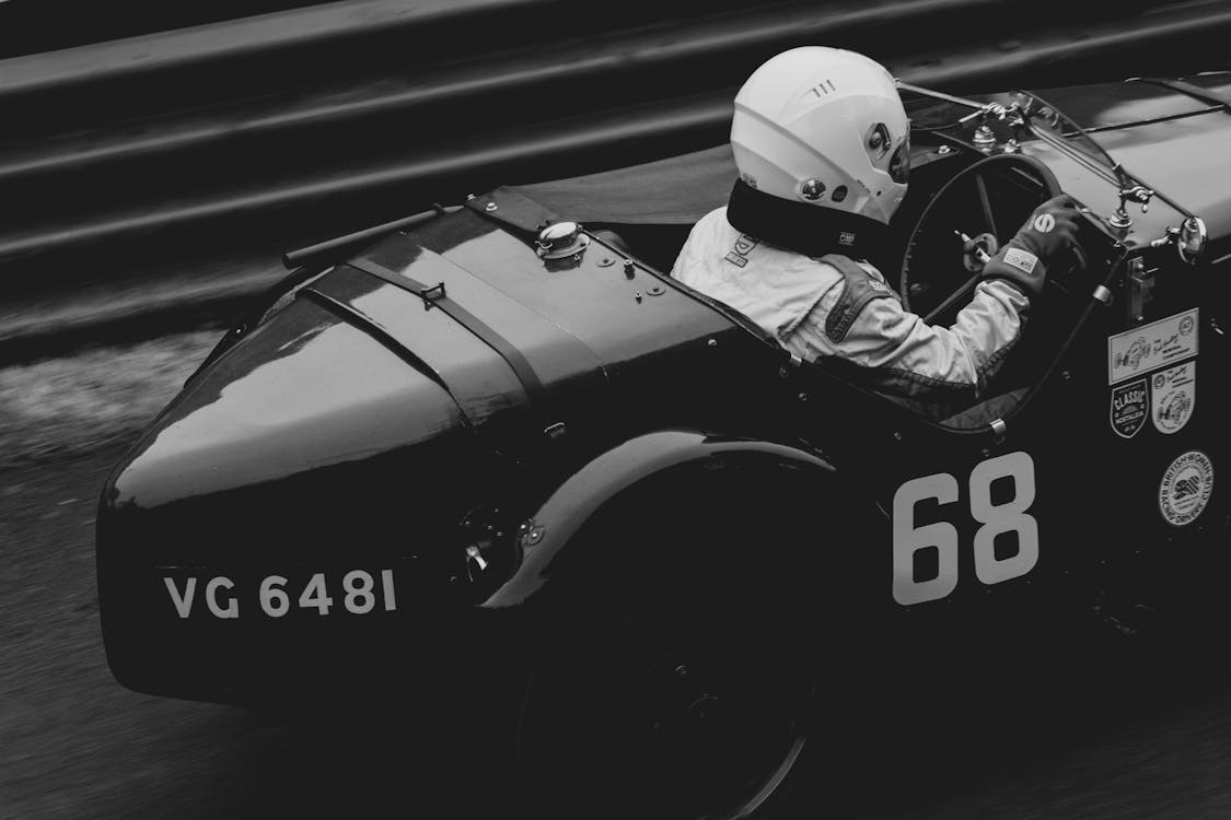 Vintage F1 Car on a Racetrack · Free