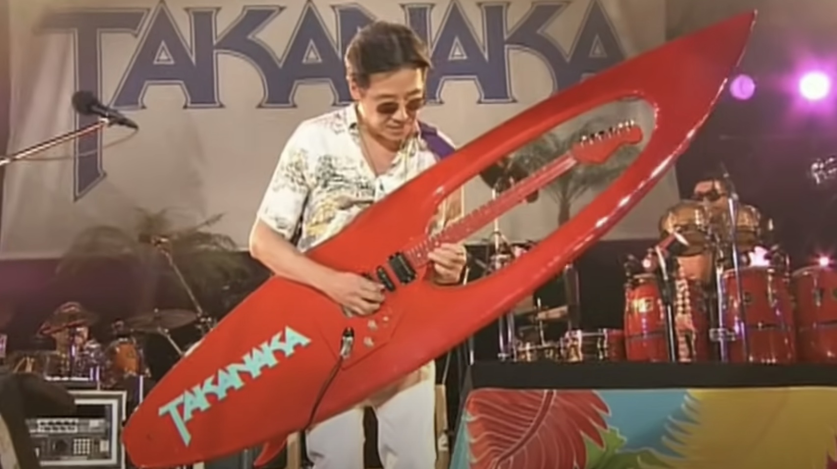 Masayoshi Takanaka shreds on a surfboard guitar