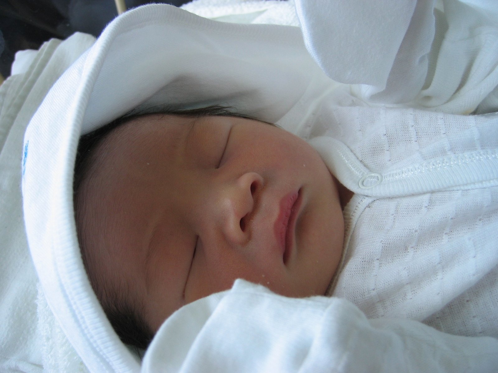 Sleeping Chinese Baby Swaddled in White Free