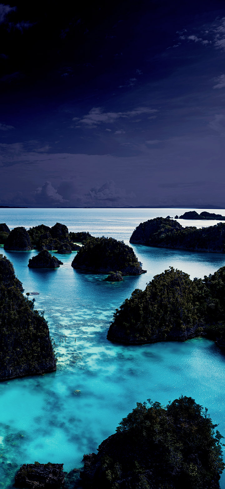 Turquoise lagoon with dark islands 4K Phone Wallpaper