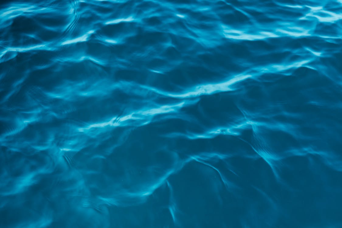 A close up of the water surface with ripples · Free