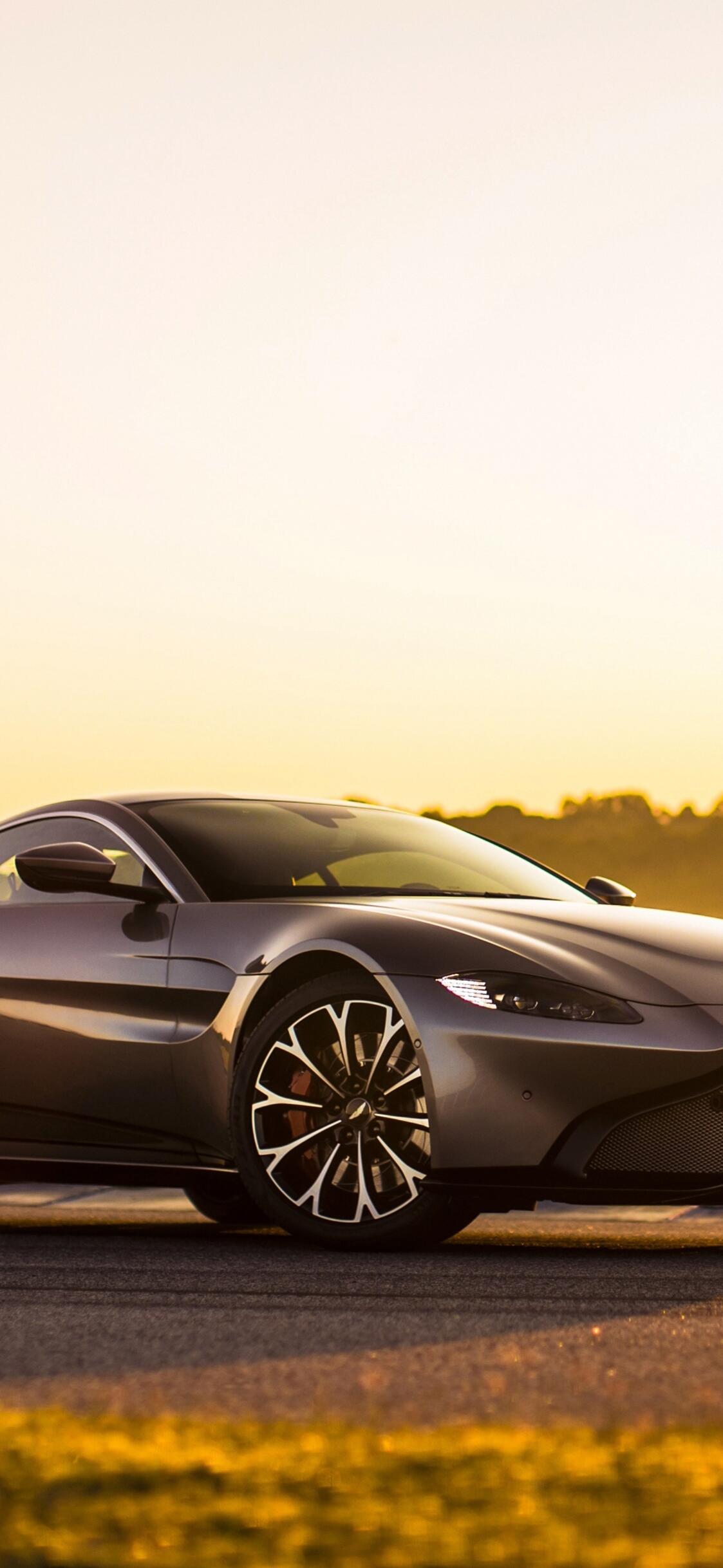 Aston martin vantage in sunny weather · 1125x2436 iPhone XS free photo from uaha and wallpaper