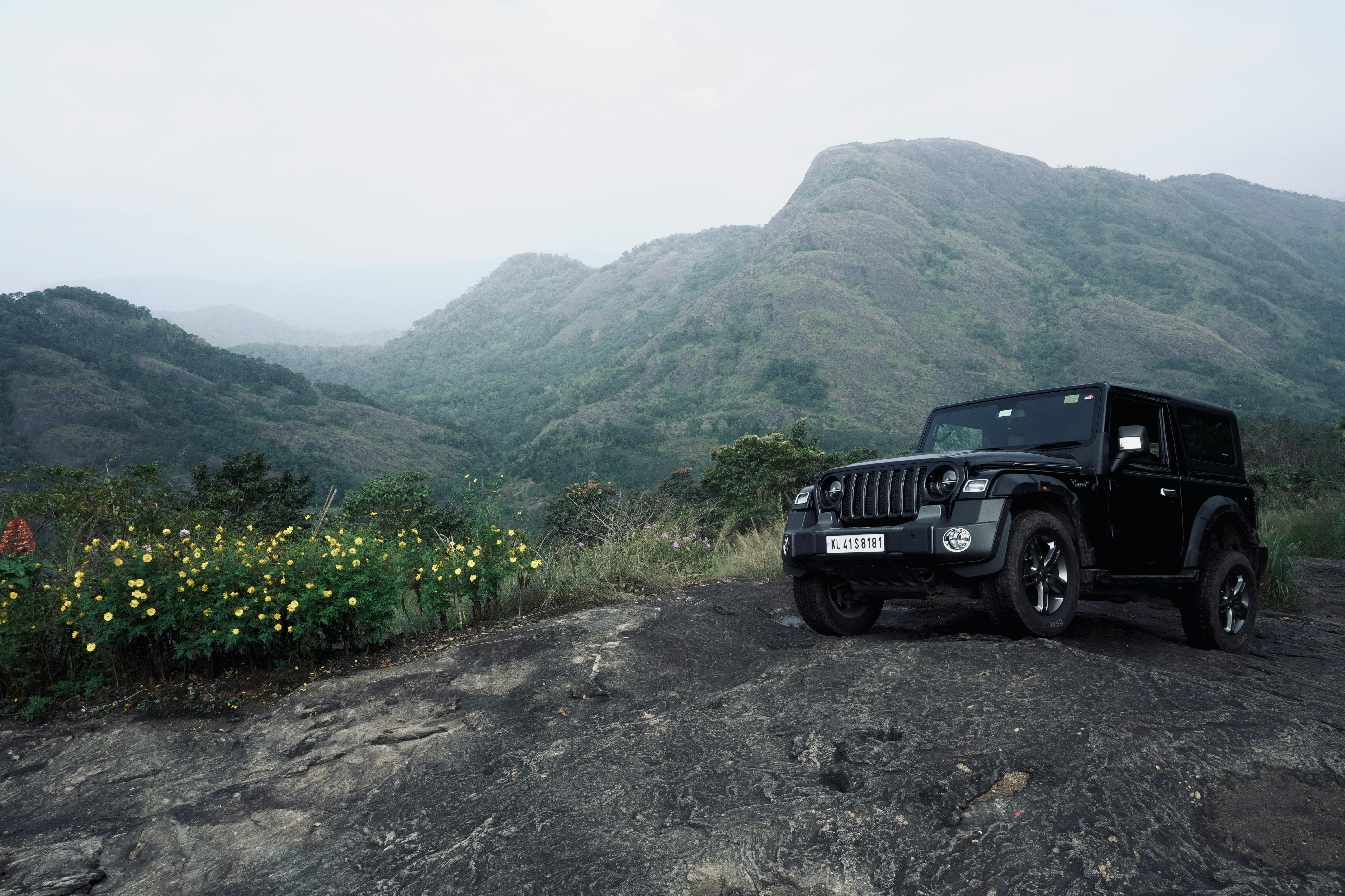 Black Jeep Parked Near Mountains · Free