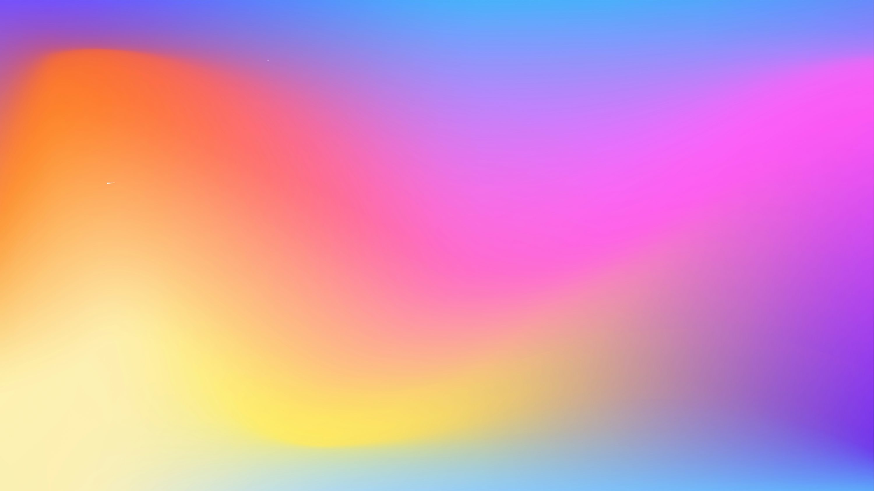 A blurry image of a rainbow colored background photo