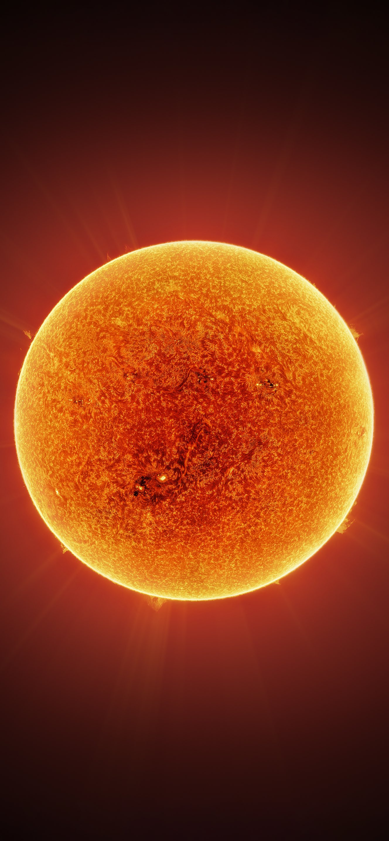Andrew McCarthy taking over 100k photo through a specially modified telescope, I captured my highest resolution photo ever of the sun's chromosphere, formatted here as a mobile wallpaper. I