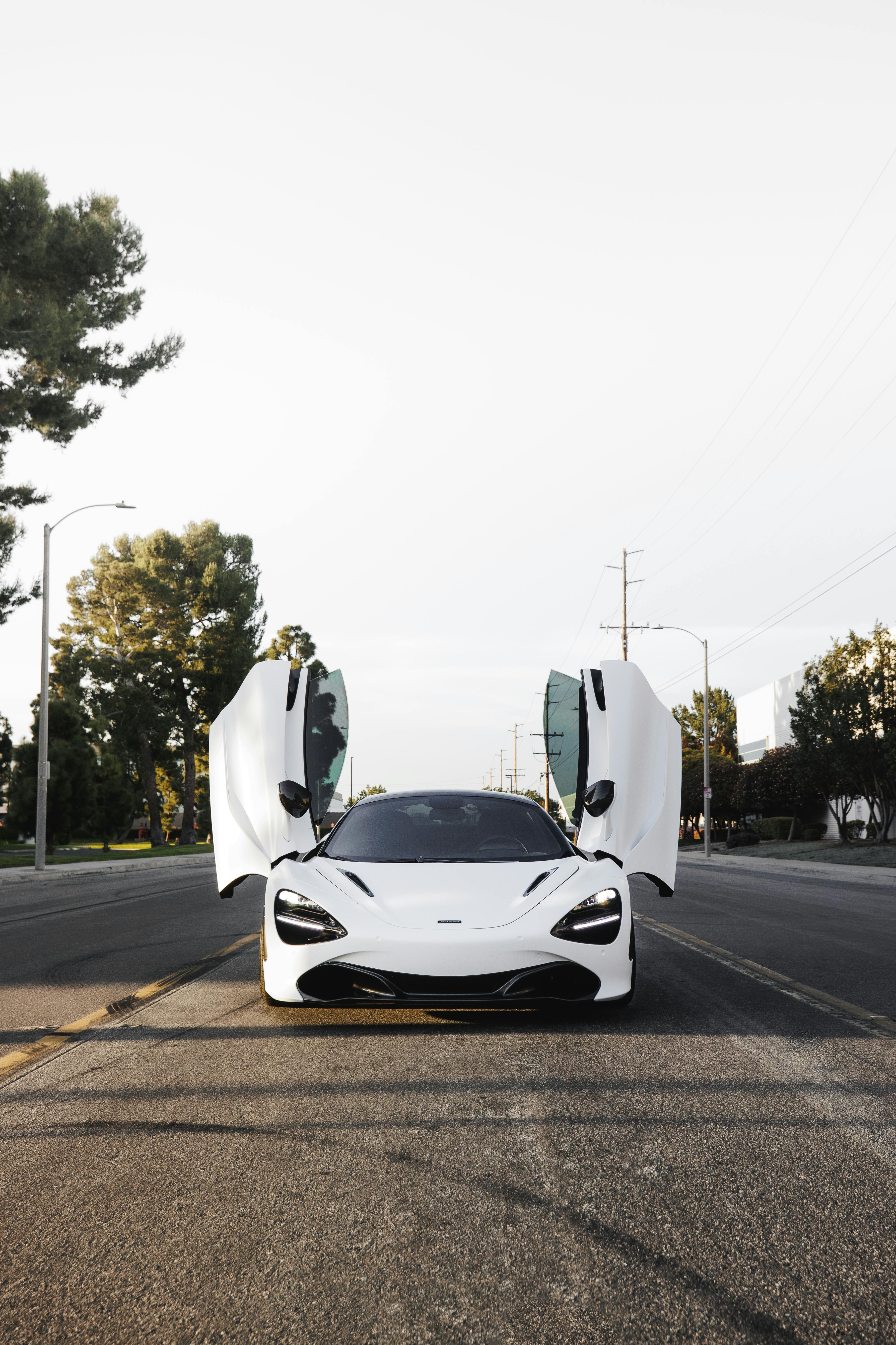 White McLaren 750S Standing on an Asphalt Street · Free