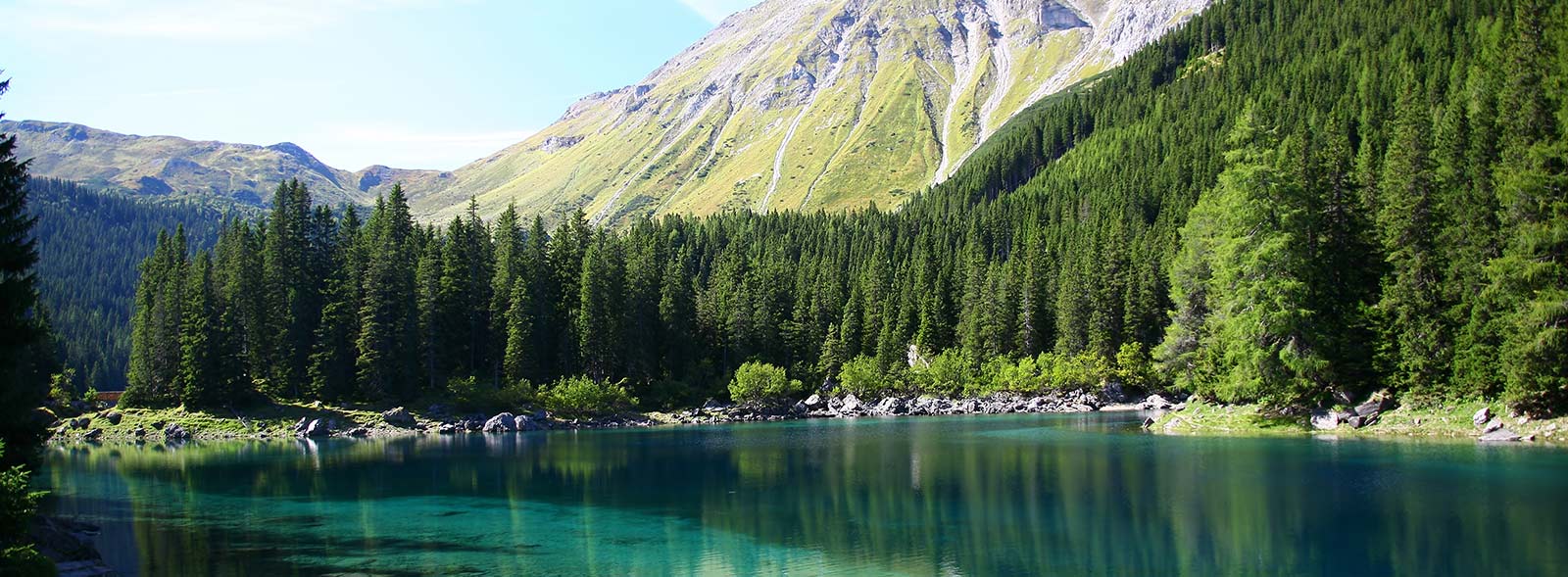 Serene Alpine Lake and Forest Landscape Mural Wallpaper in Vibrant Greens and Blues