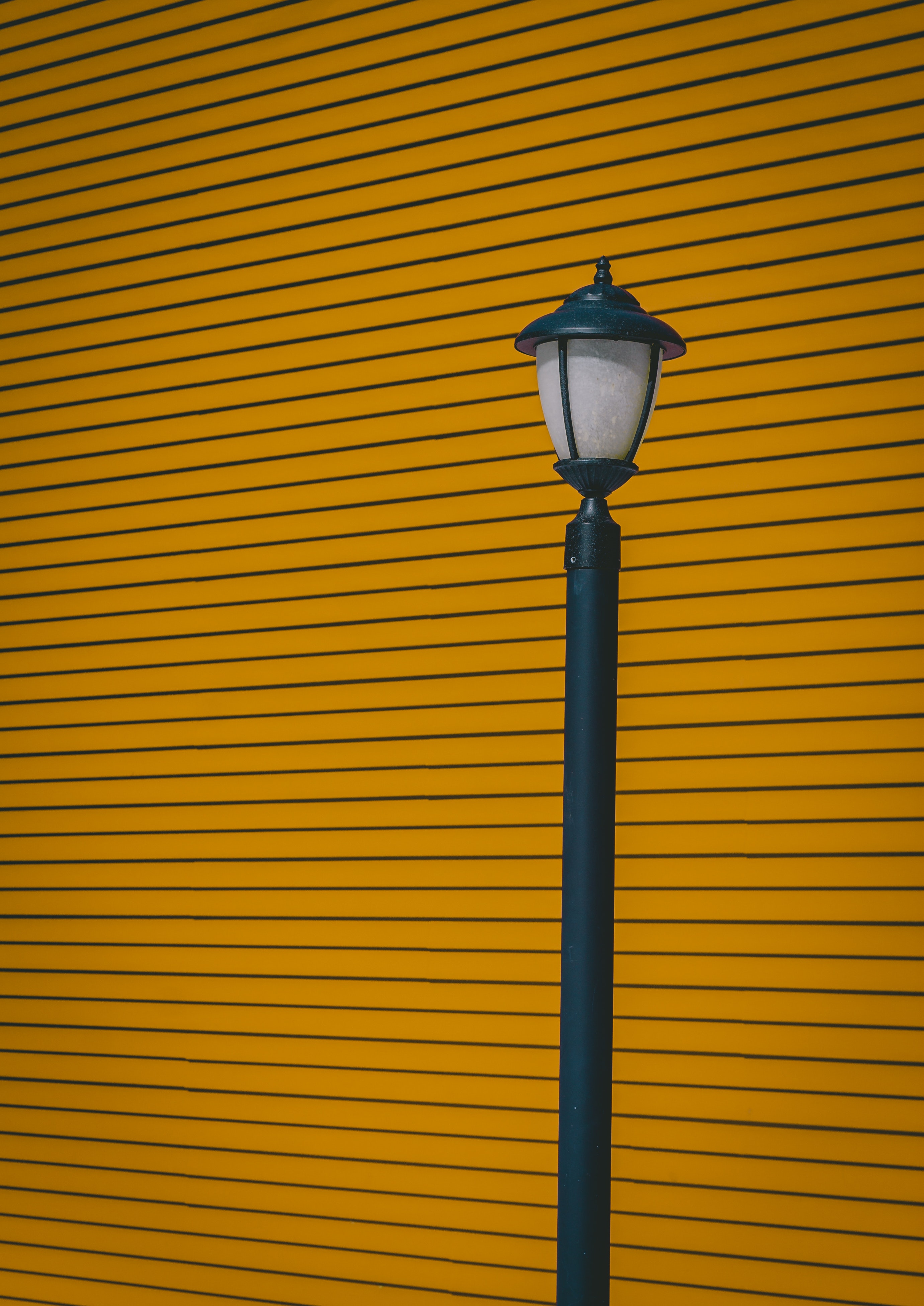 Download wallpaper 2762x3901 lamp post, wall, pillar, stripes, minimalism HD background
