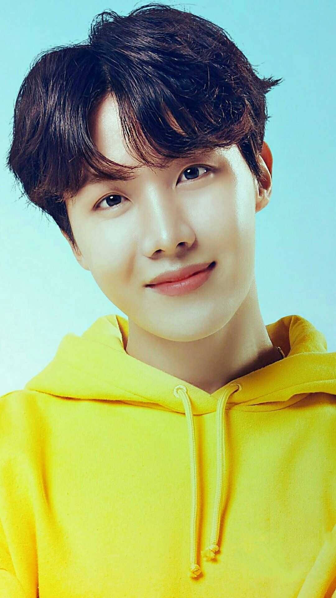 Download J Hope Donning A Yellow Hoodie Wallpaper