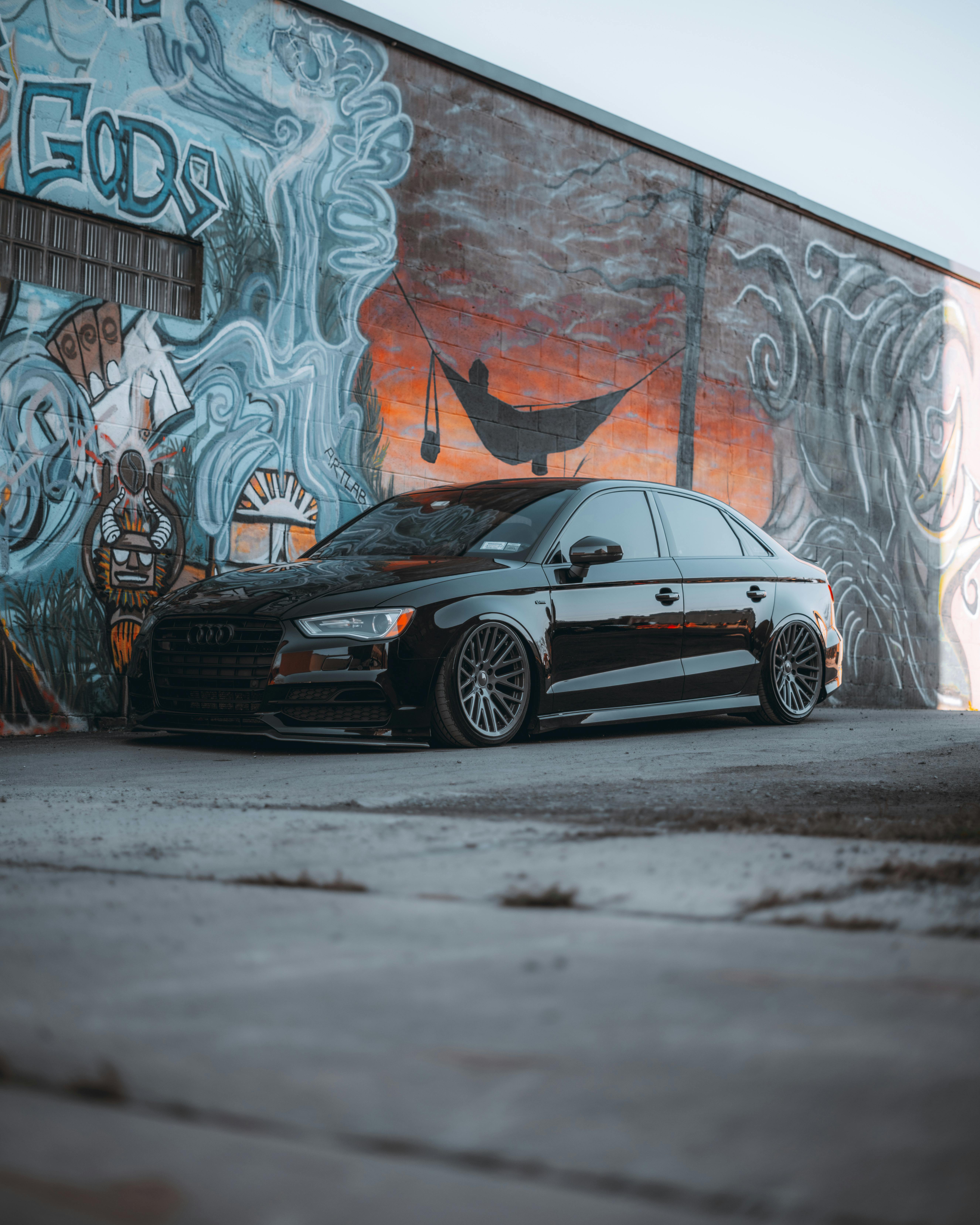 Black Car Next to Graffiti on Wall · Free