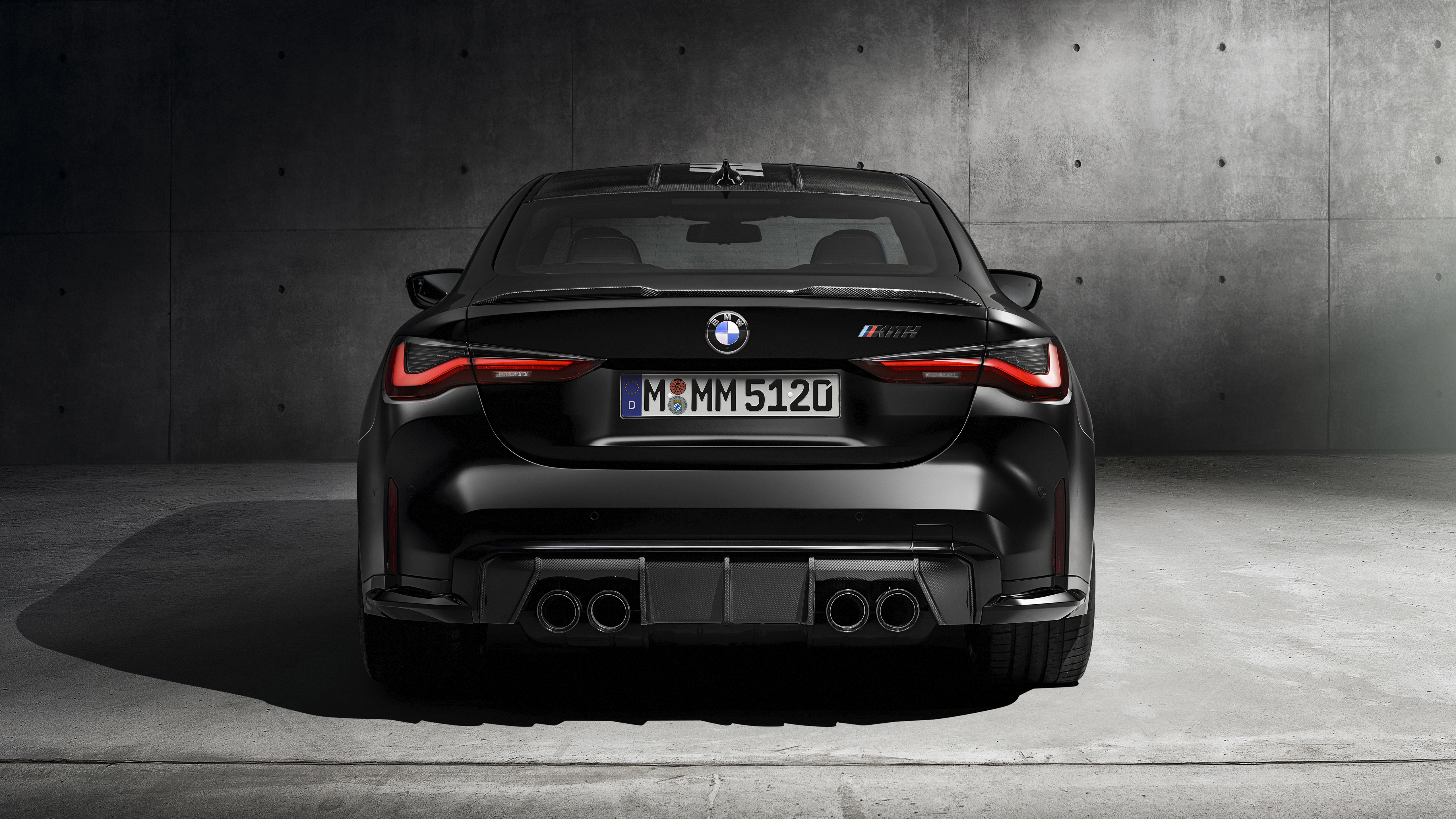 Black BMW M4, 2021 rear view on gray background Desktop wallpaper 1024x1024